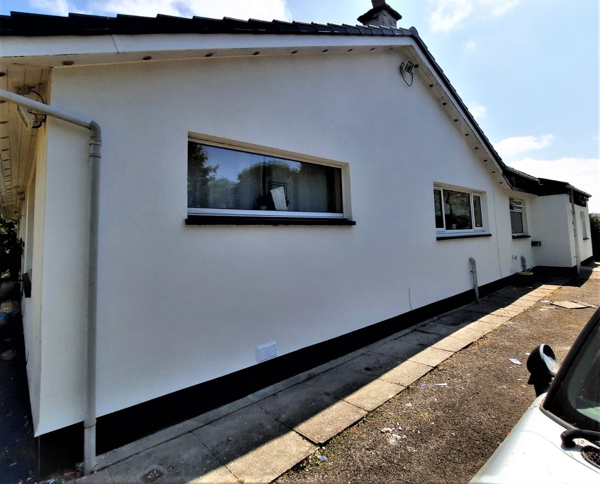 house rendering Edinburgh on side wall with black skirting