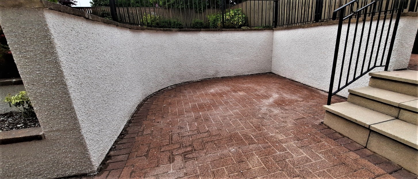 solid wall insulation Edinburgh applied along curved driveway wall
