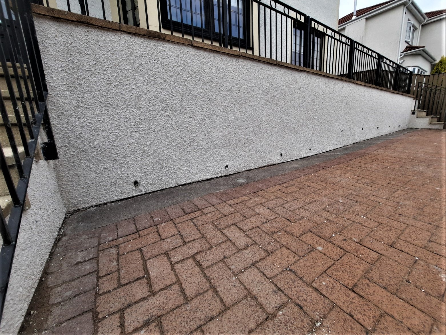 house rendering Edinburgh on wall with black metal railings