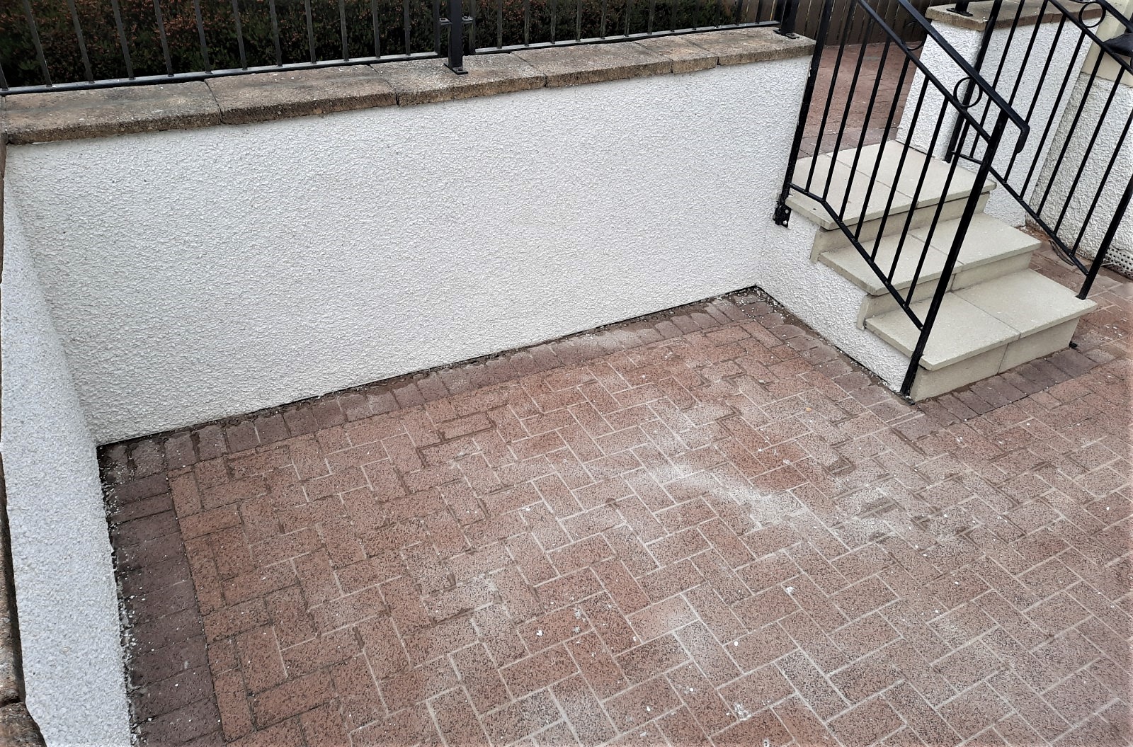 house rendering Edinburgh along driveway corner wall