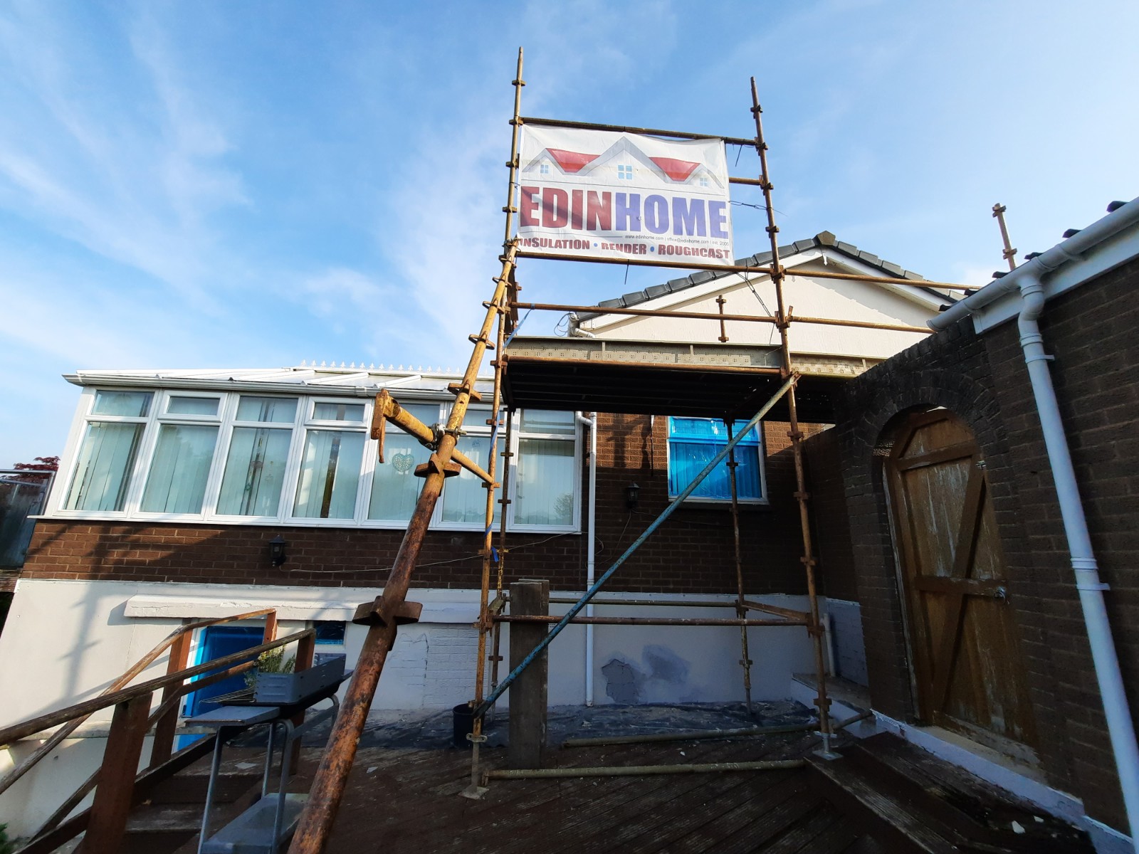 Insulation Edinburgh beneath render on long garden wall section