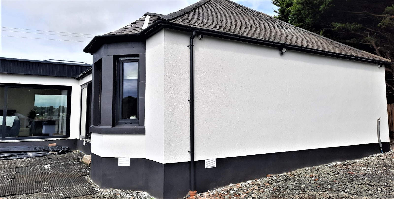 solid wall insulation Edinburgh on white and black painted elevation