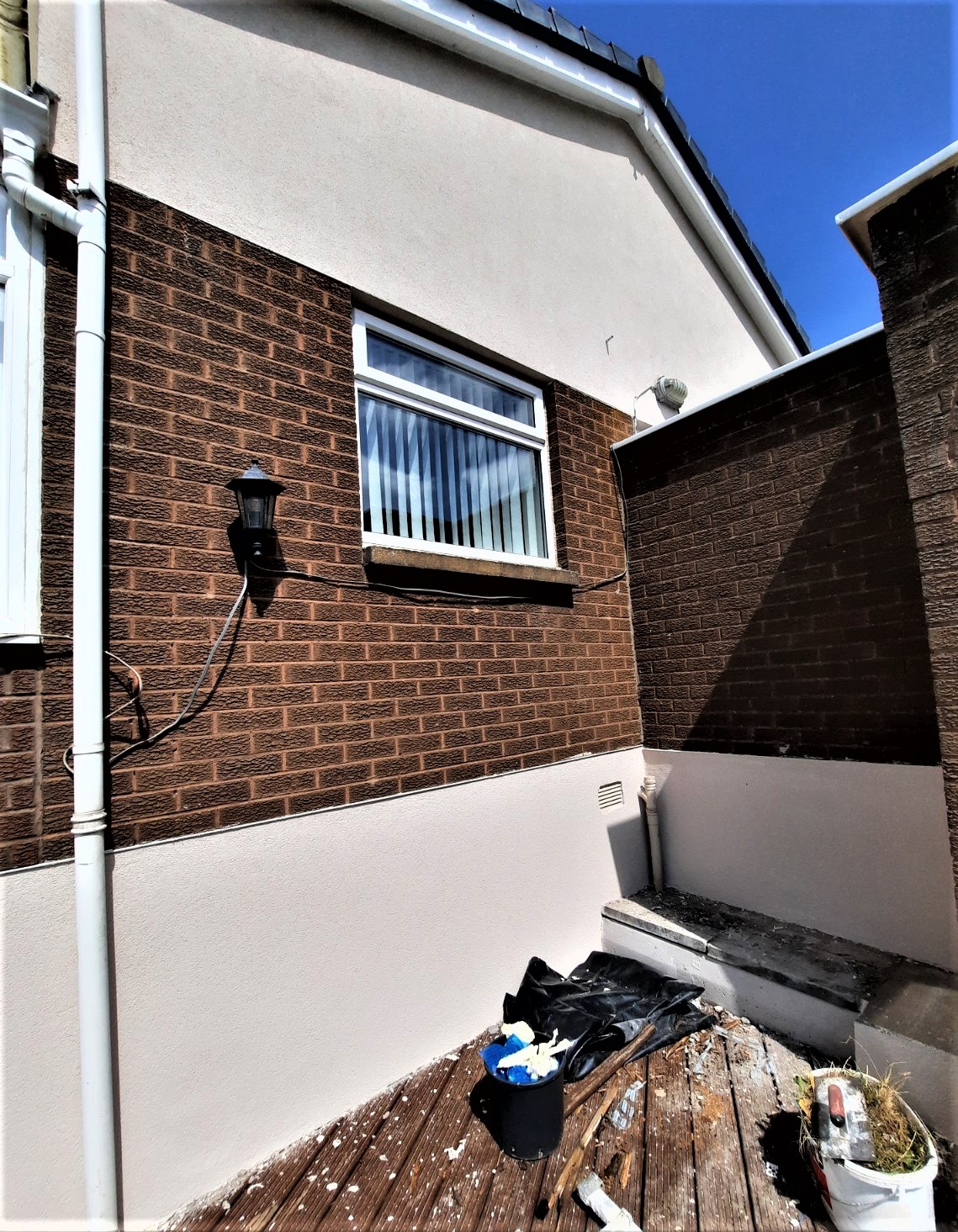roughcaster Edinburgh working on side elevation with white trim