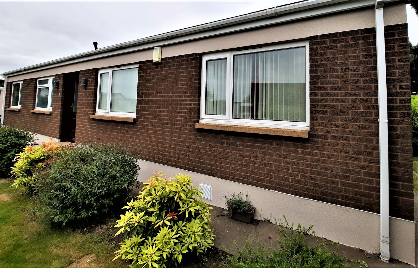 roughcast render Edinburgh on rear wall beneath large window