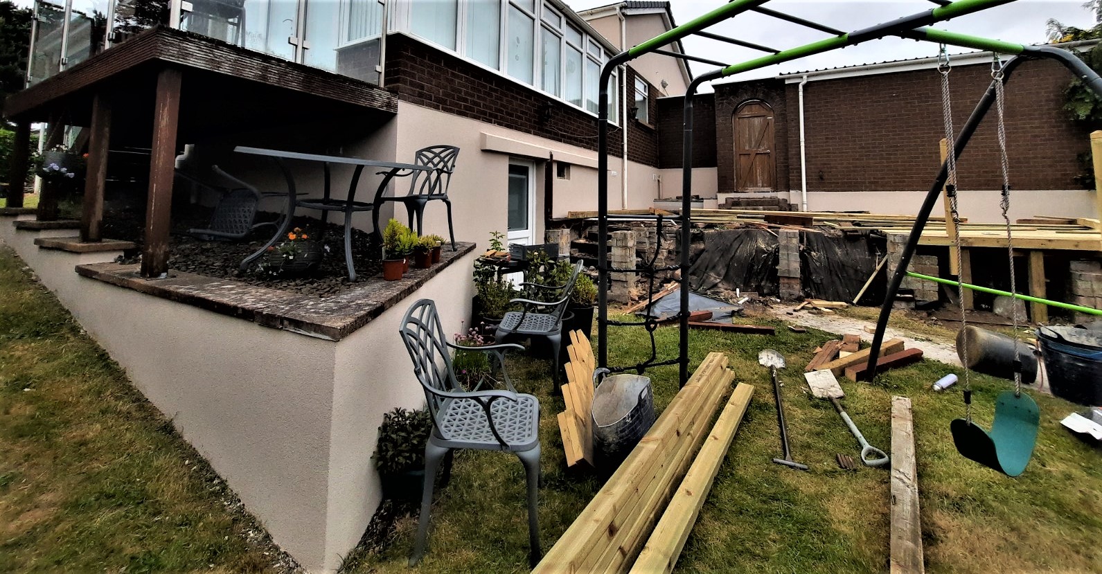 roughcast repair along garden wall beneath windows