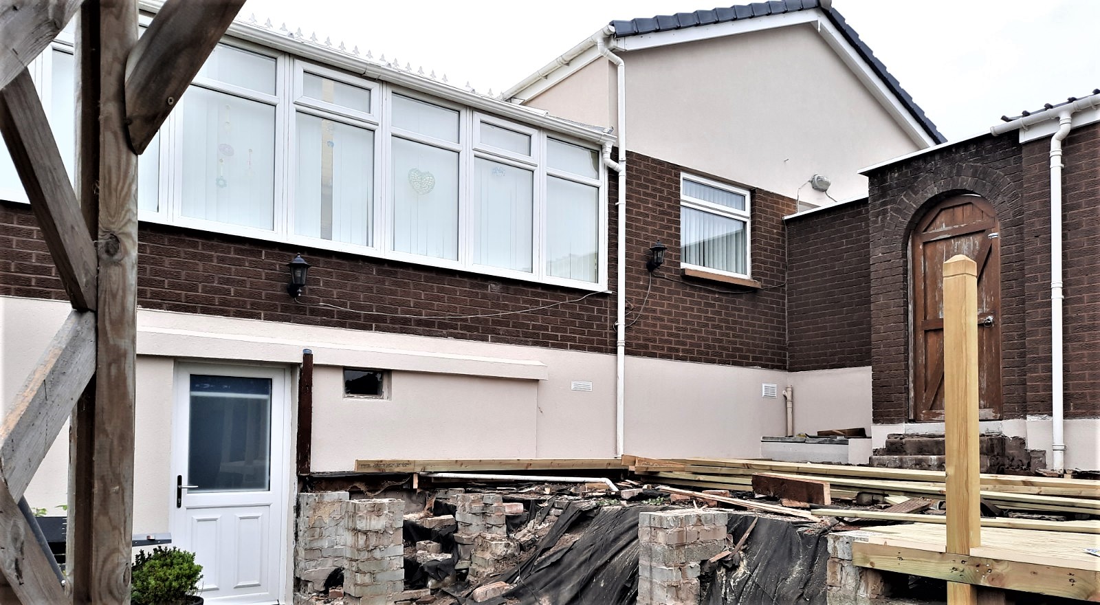 roughcast render repair on brick and render extension base