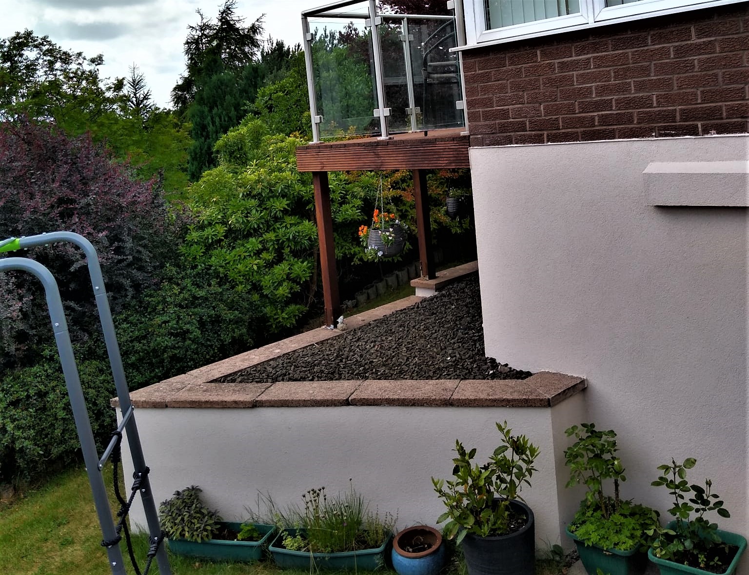 Insulation Edinburgh beneath freshly coated garden retaining wall
