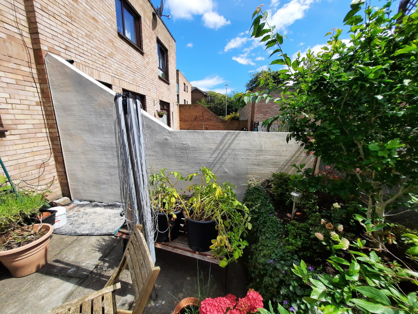 Insulation Edinburgh behind freshly rendered garden wall
