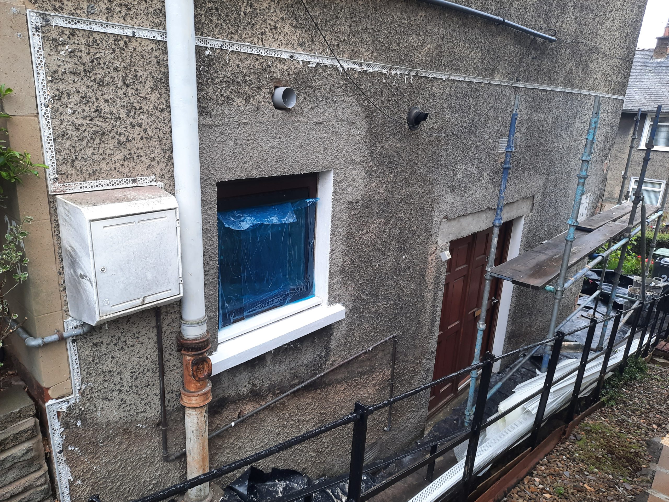 roughcast render Edinburgh repair in progress on side elevation