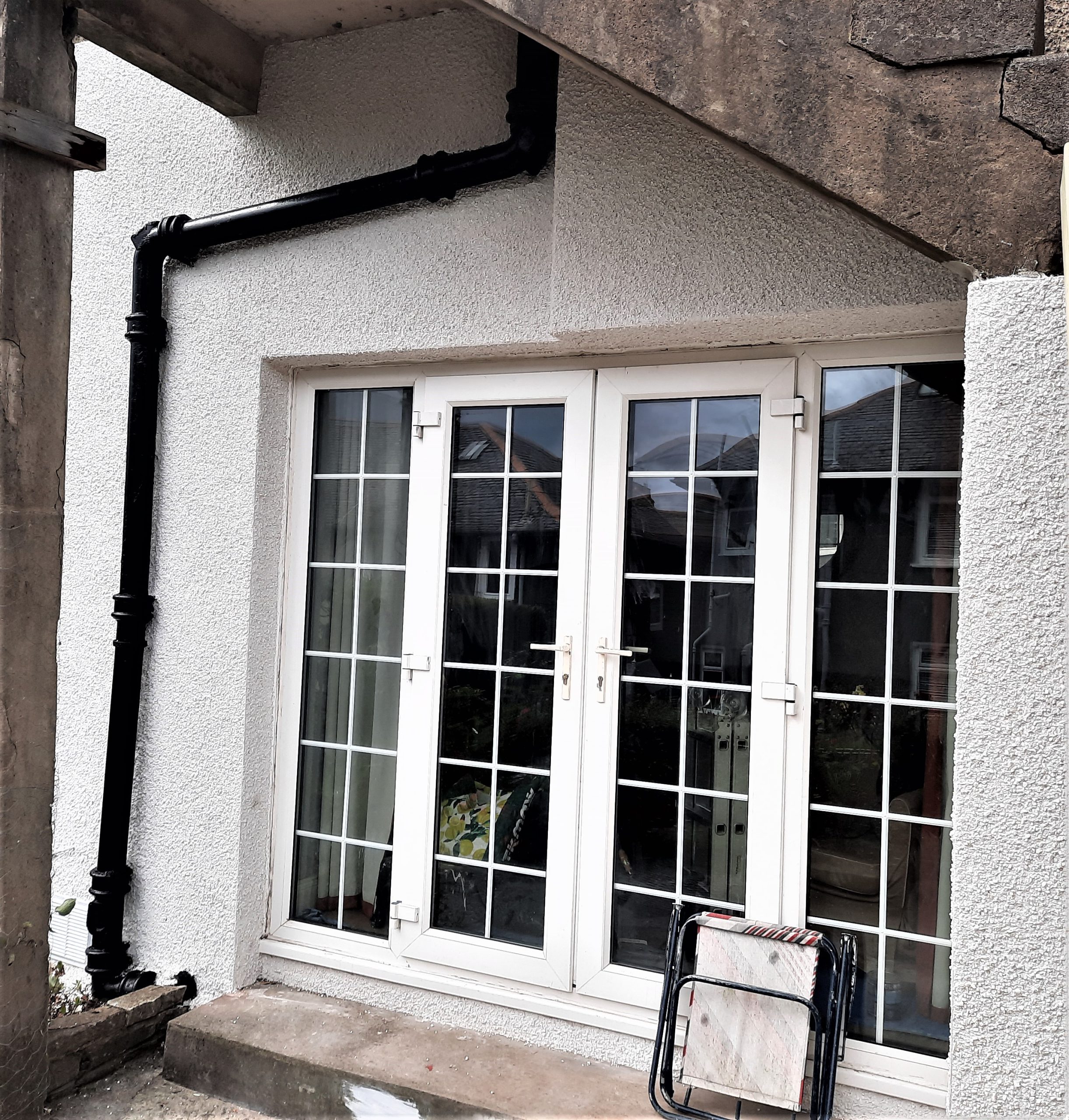 Insulation Edinburgh beneath smooth white render on rear elevation