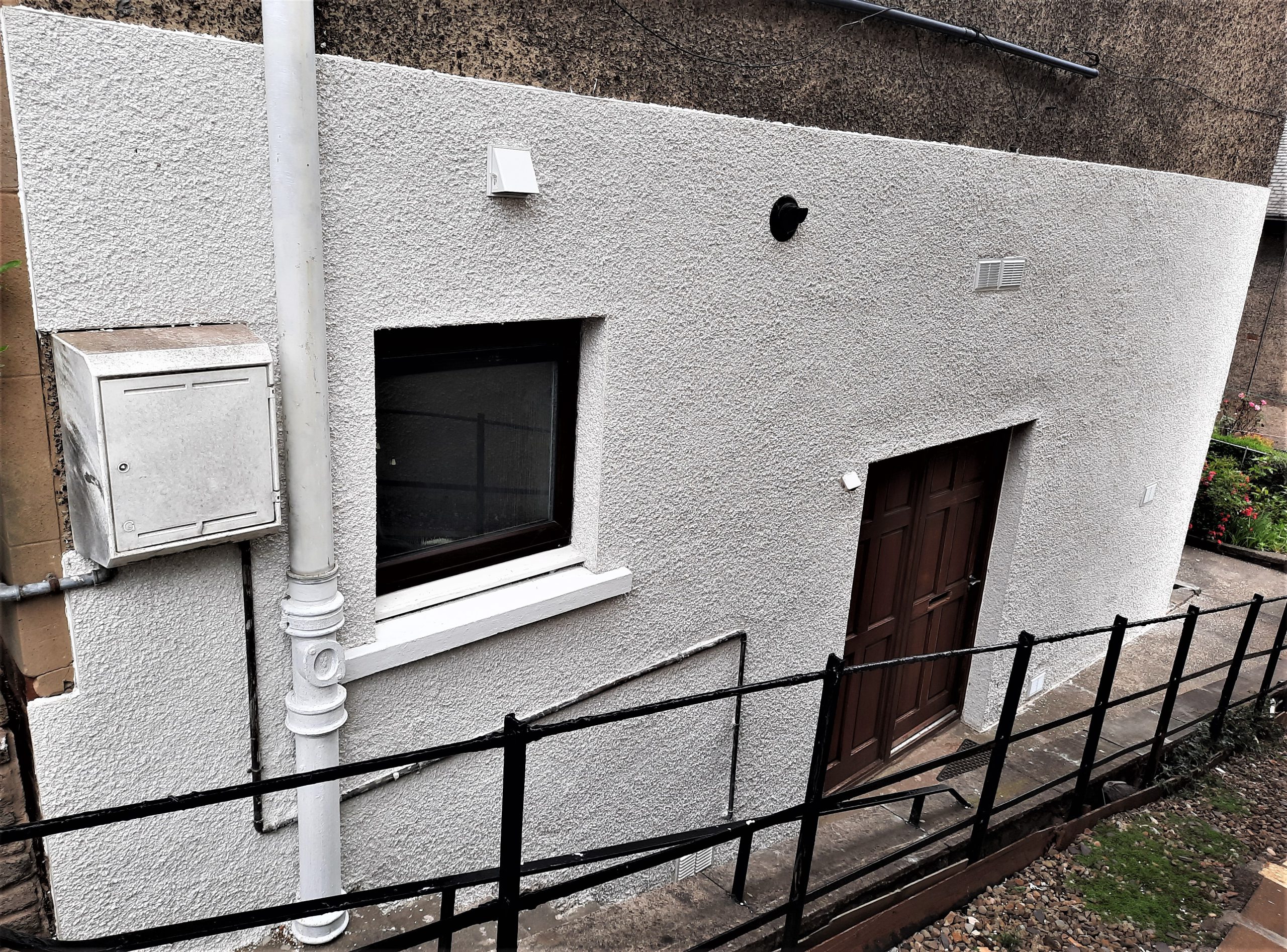 house rendering Edinburgh on white wall with patio doors