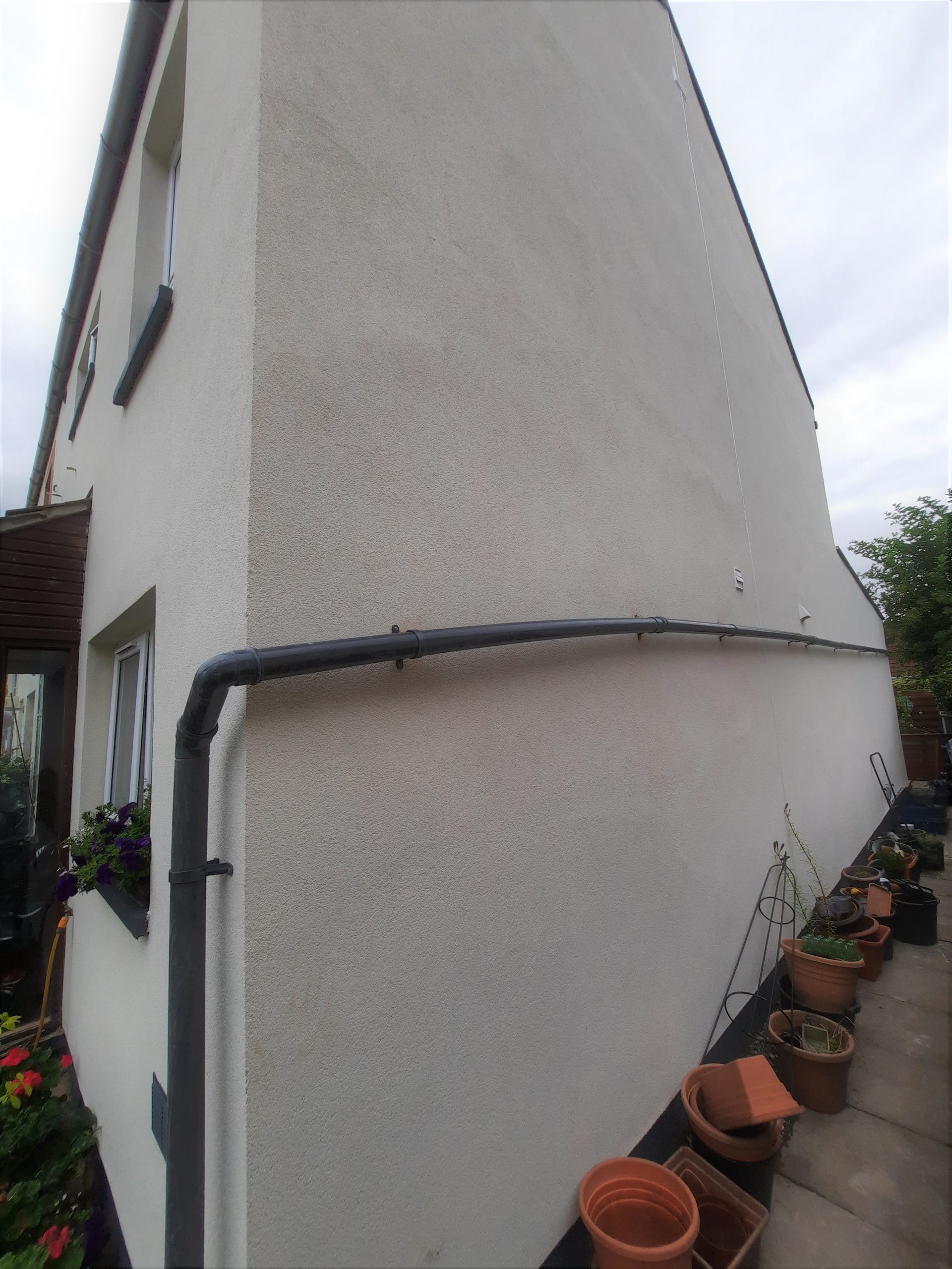 Insulation Edinburgh beneath clean render finish on corner wall