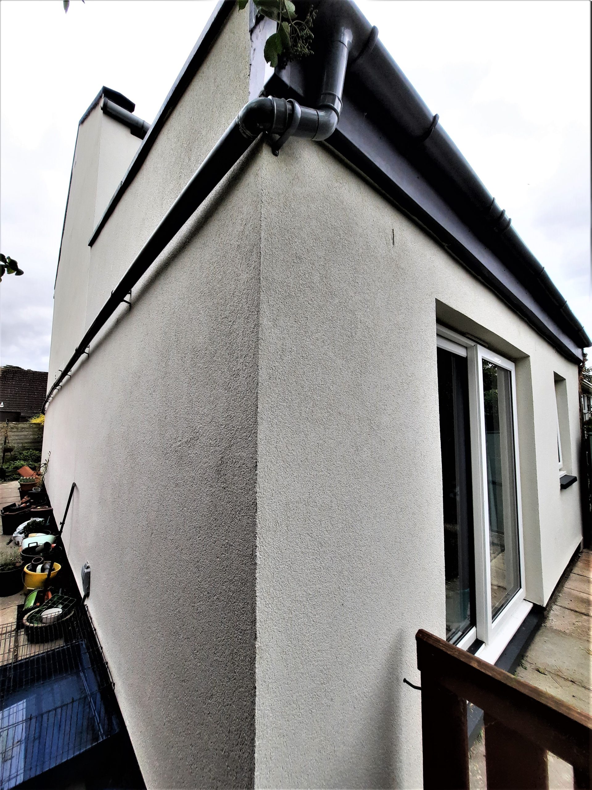 house rendering Edinburgh on smooth white rear wall