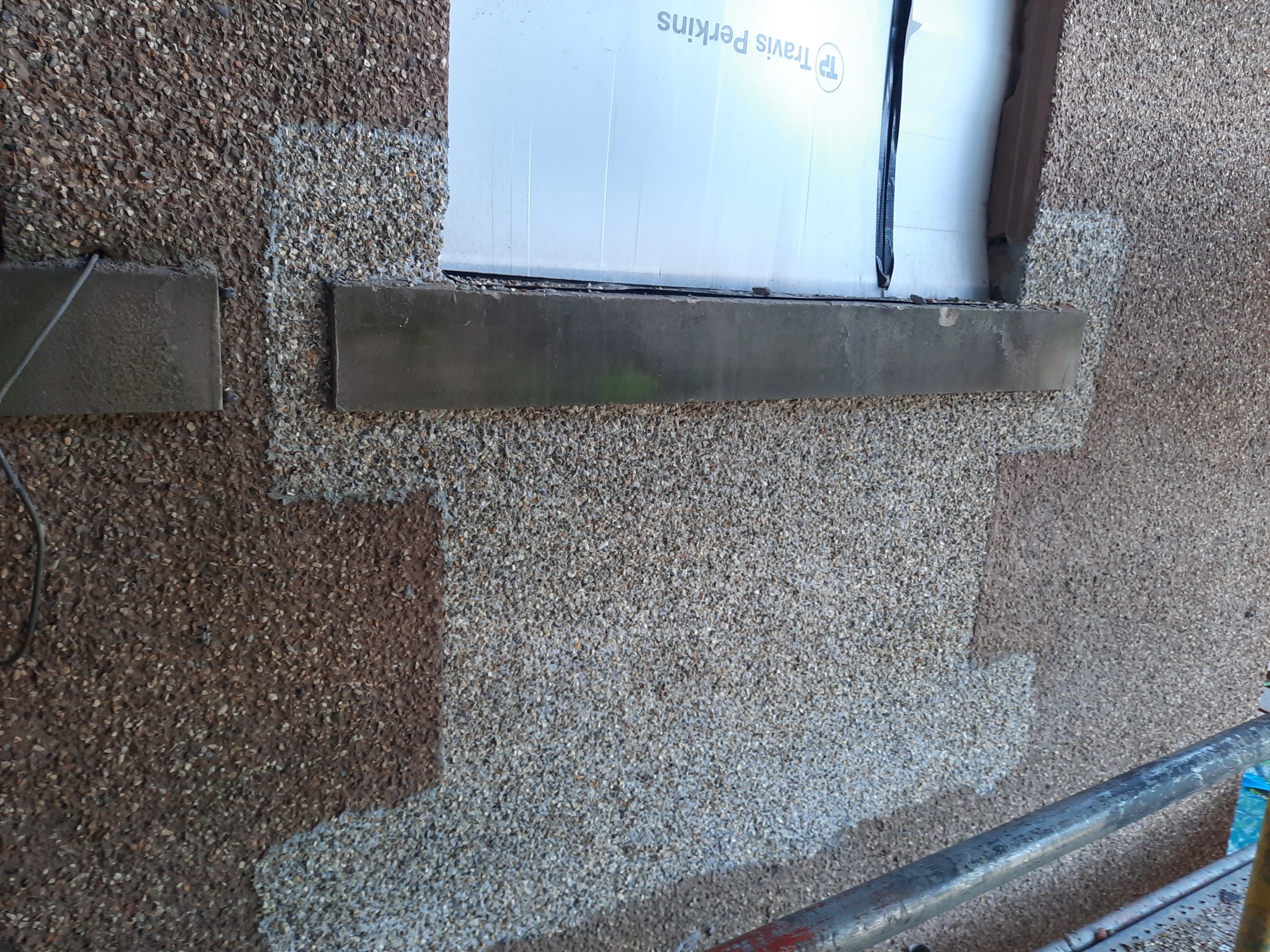roughcast repair around insulated window area