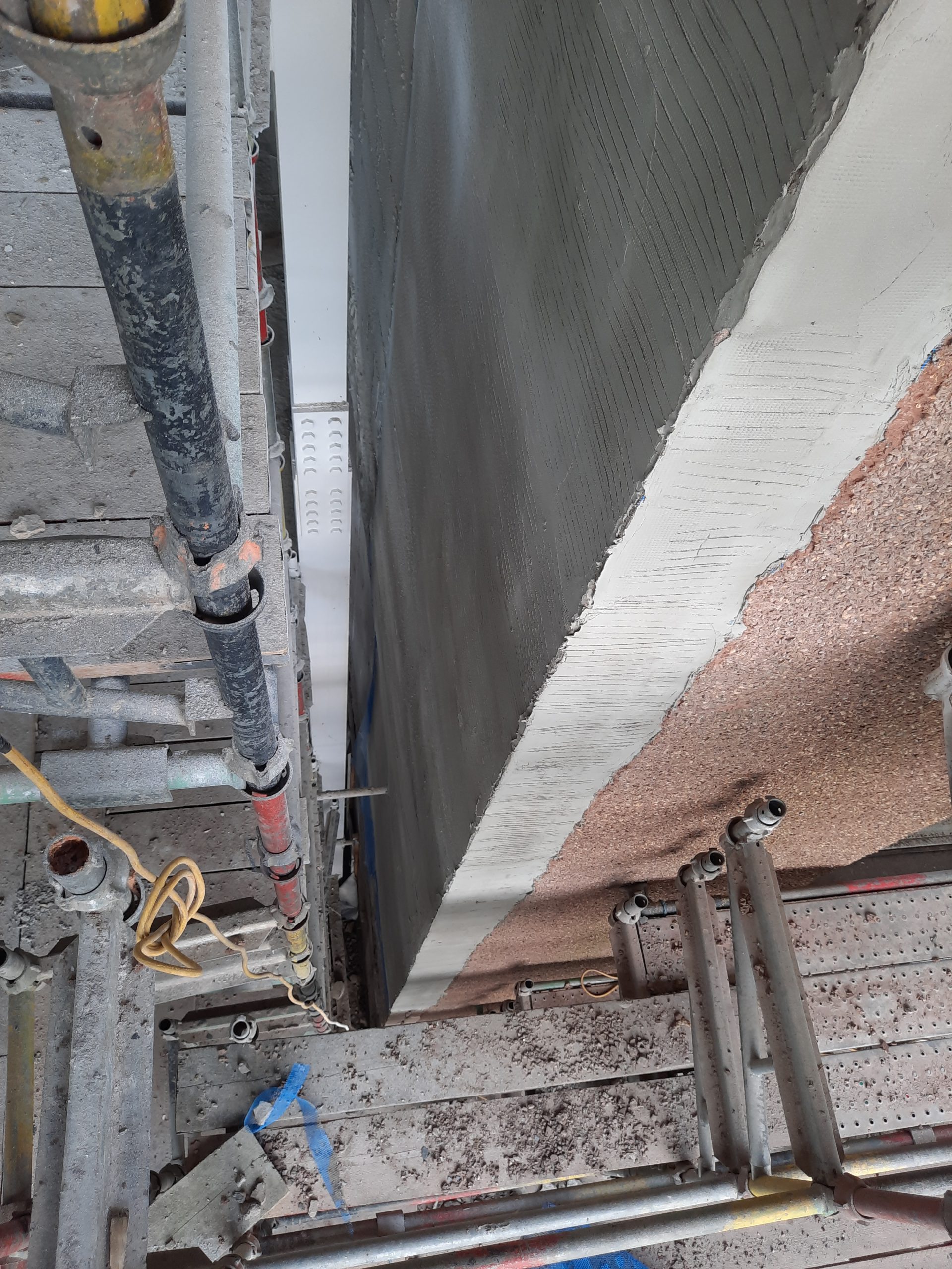 roughcaster Edinburgh applying fresh render to stripped section