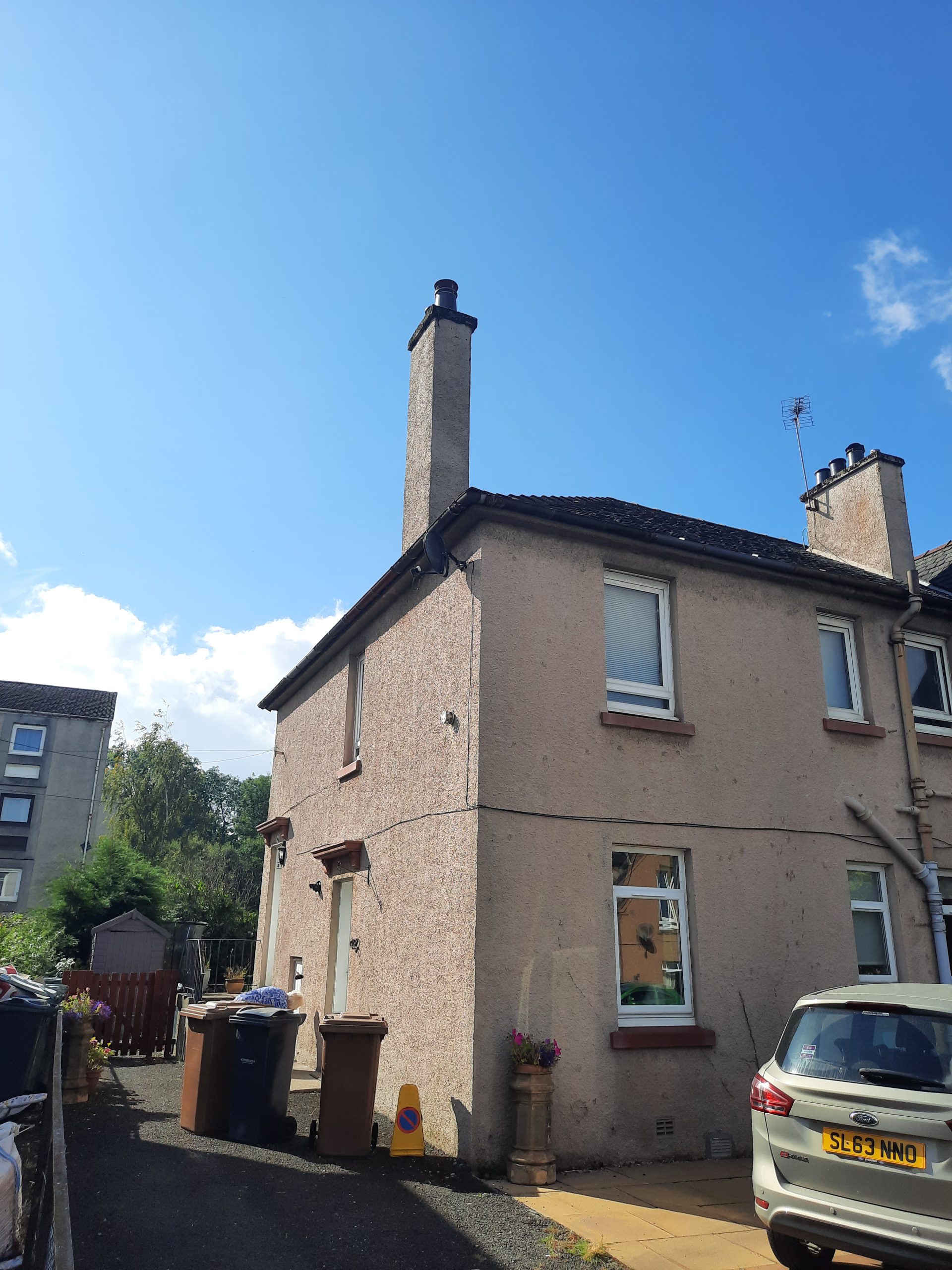 Rendering Edinburgh on beige two-storey house with chimney