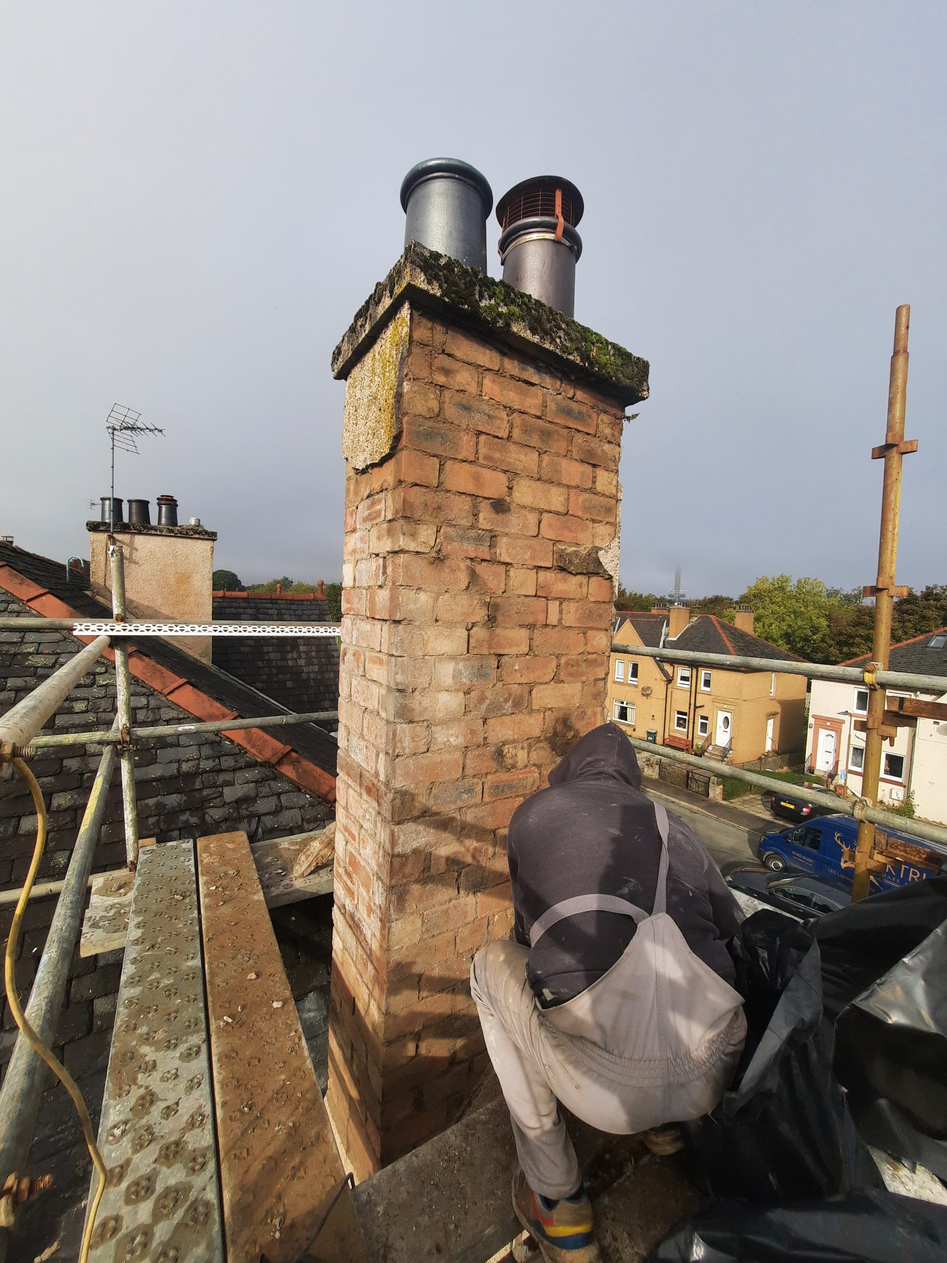 roughcaster Edinburgh working on brick chimney restoration