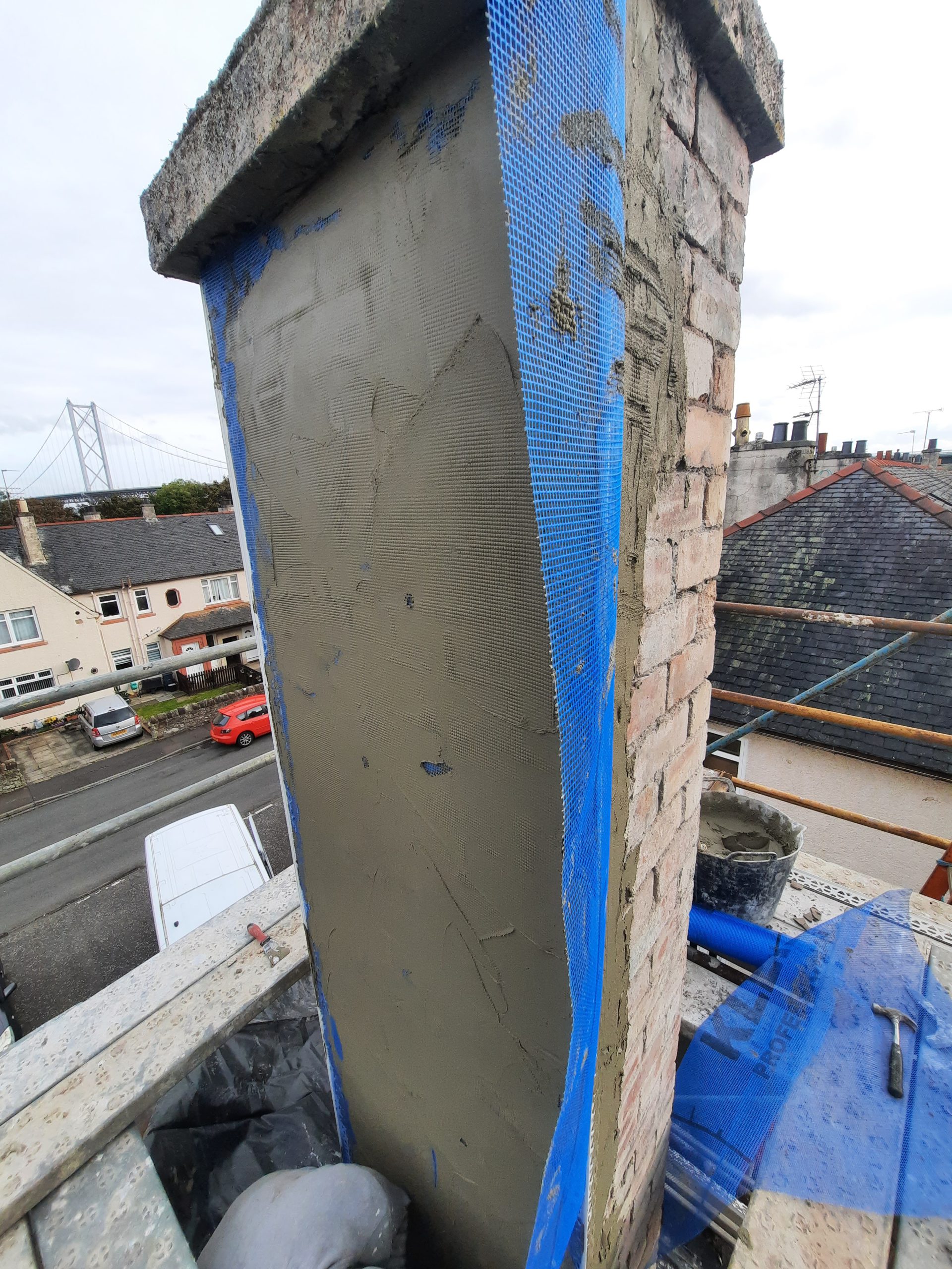 roughcast render Edinburgh applied by trowel to chimney surface