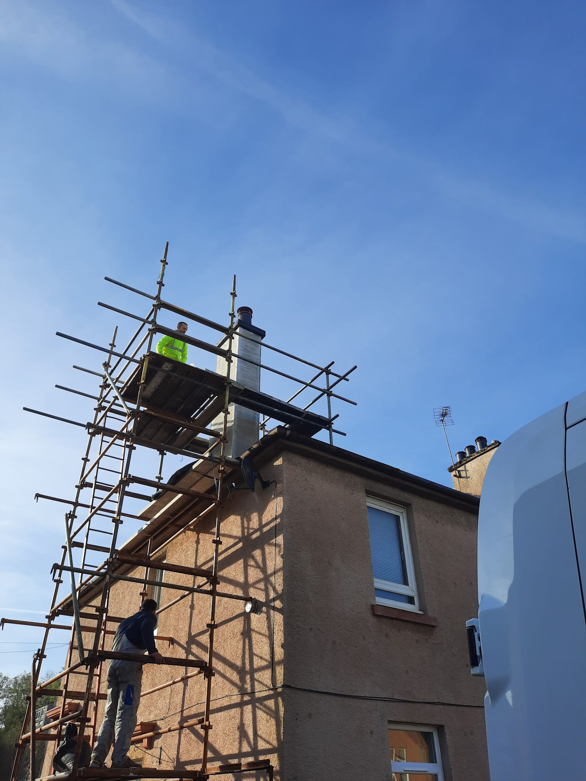 roughcasting Edinburgh on house with full chimney scaffolding