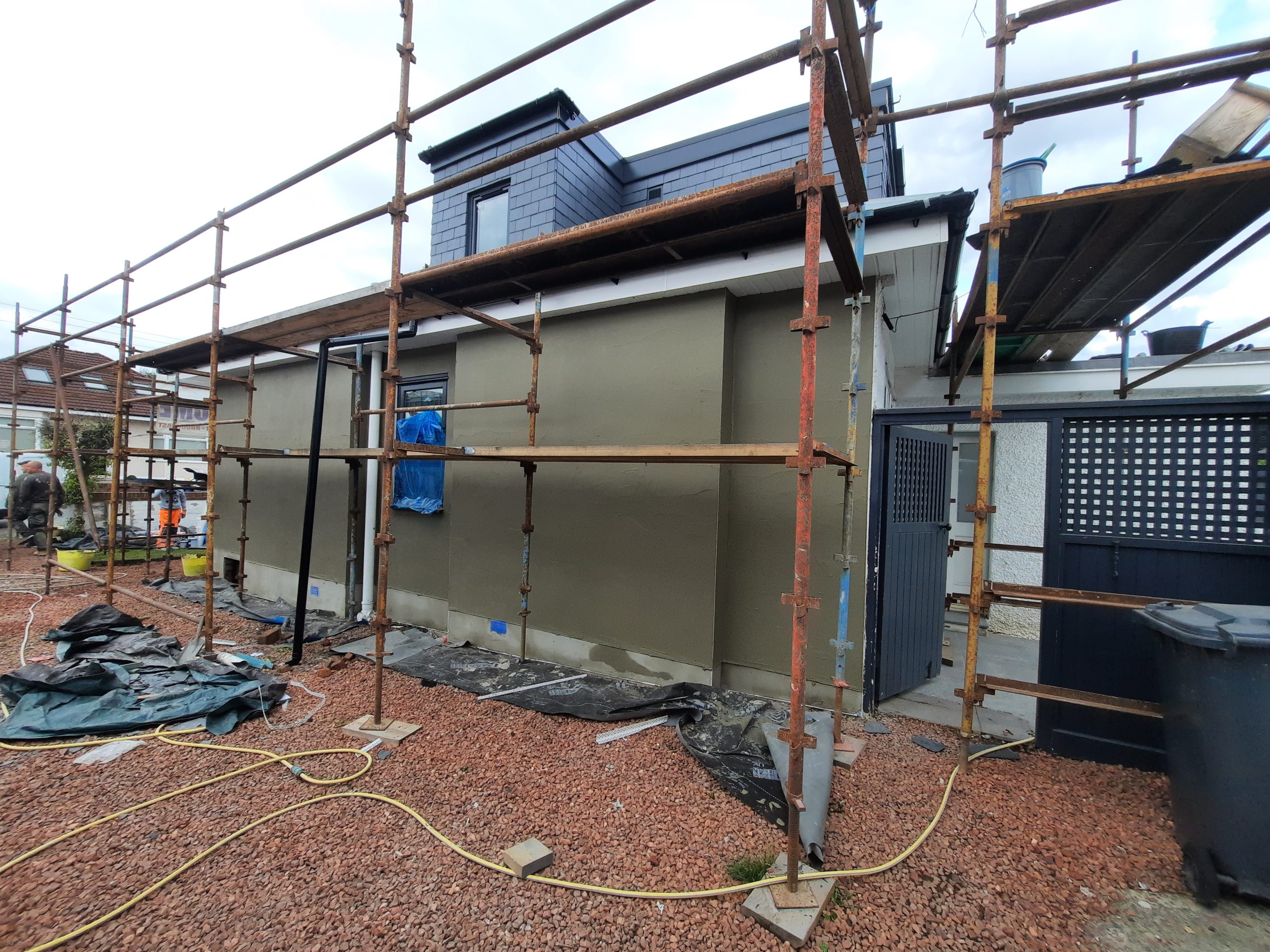 house rendering Edinburgh with new render applied under scaffolding