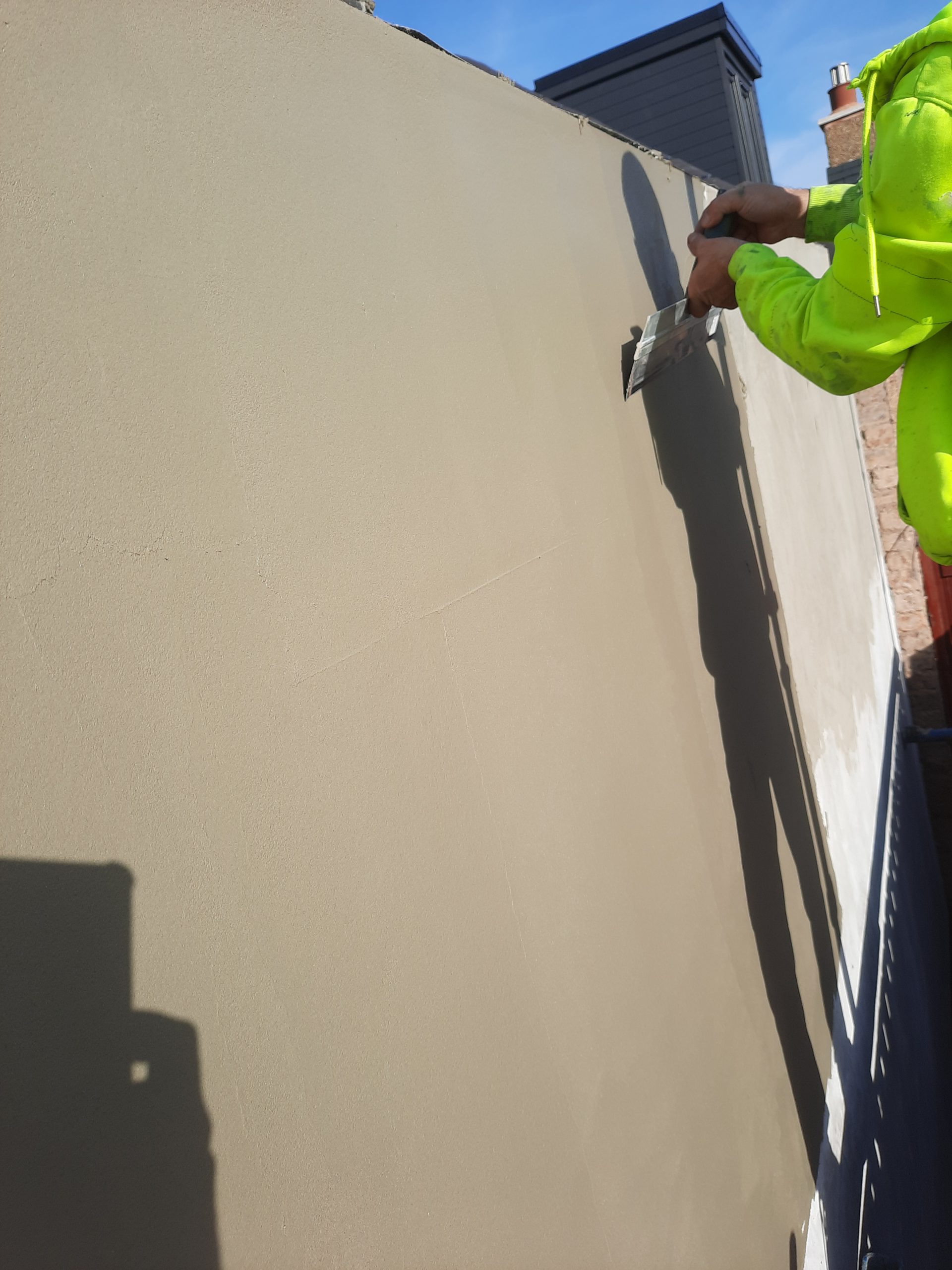 roughcast render Edinburgh applied by trowel on exterior wall