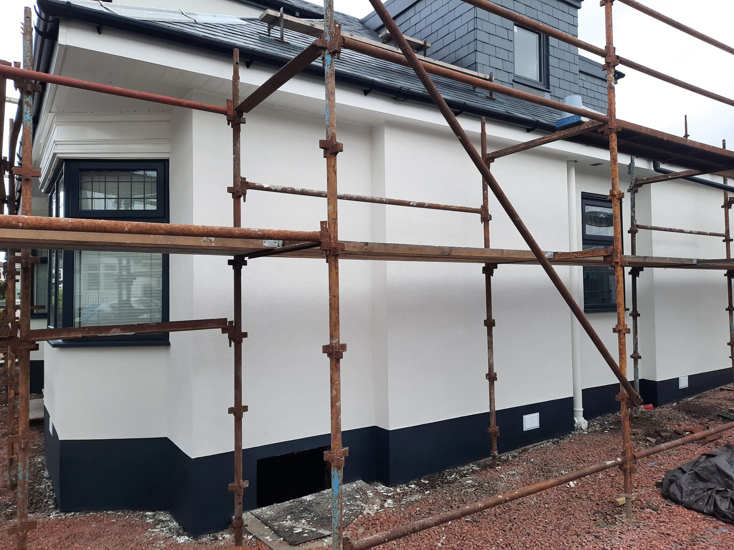 roughcaster Edinburgh finishing wall beside front garden