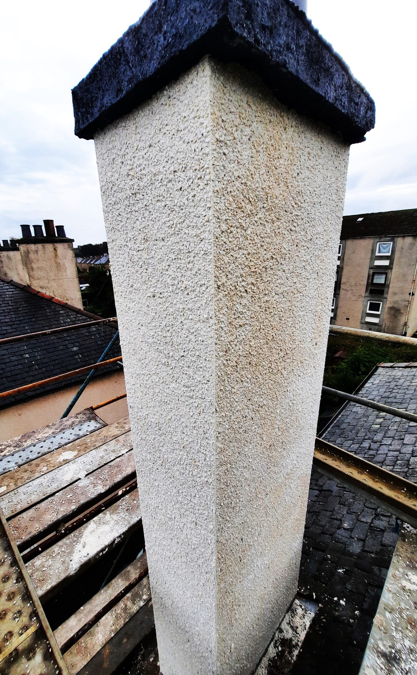 Insulation Edinburgh beneath fresh render on chimney stack
