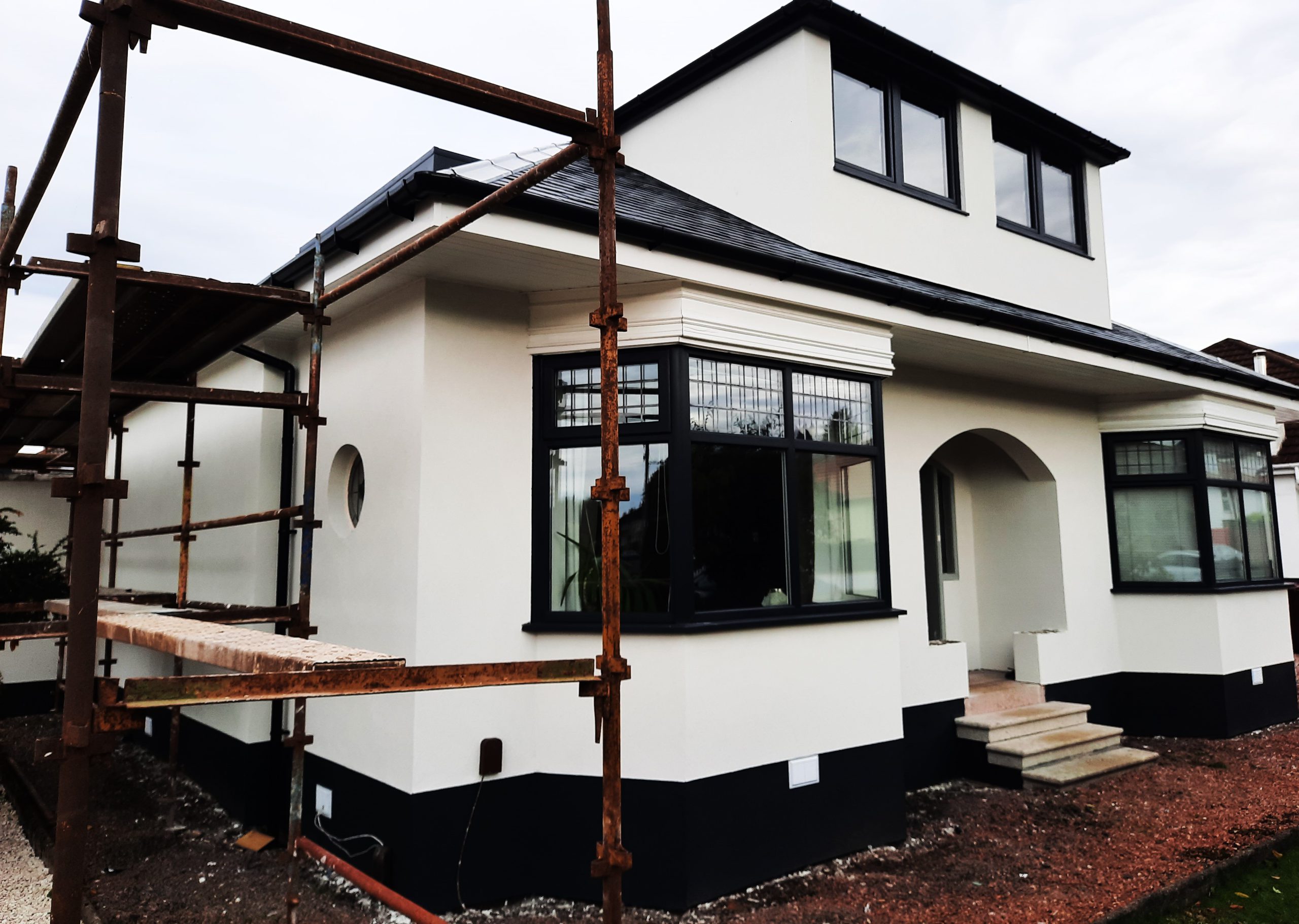 house rendering Edinburgh under renovation with front scaffolding