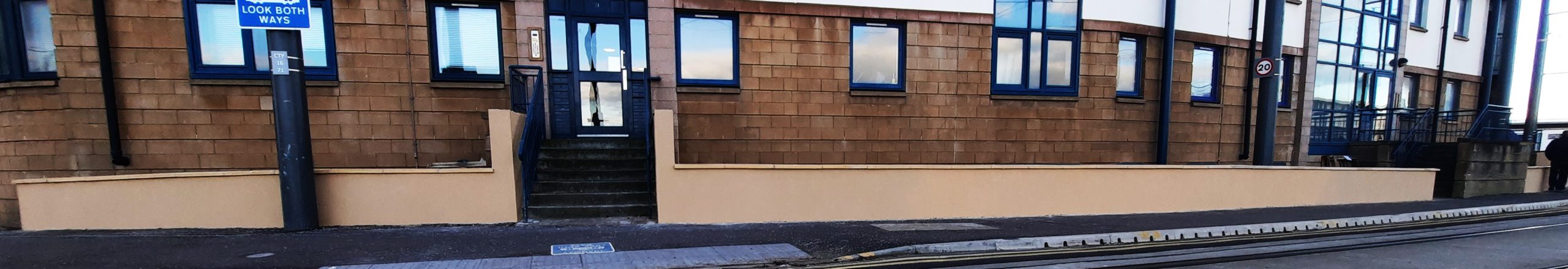 roughcast render Edinburgh on fresh beige wall beneath windows