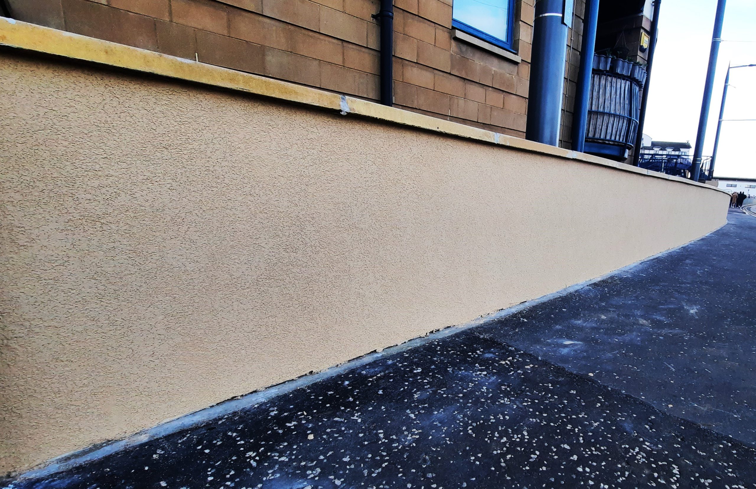 house rendering Edinburgh on side boundary with white trim