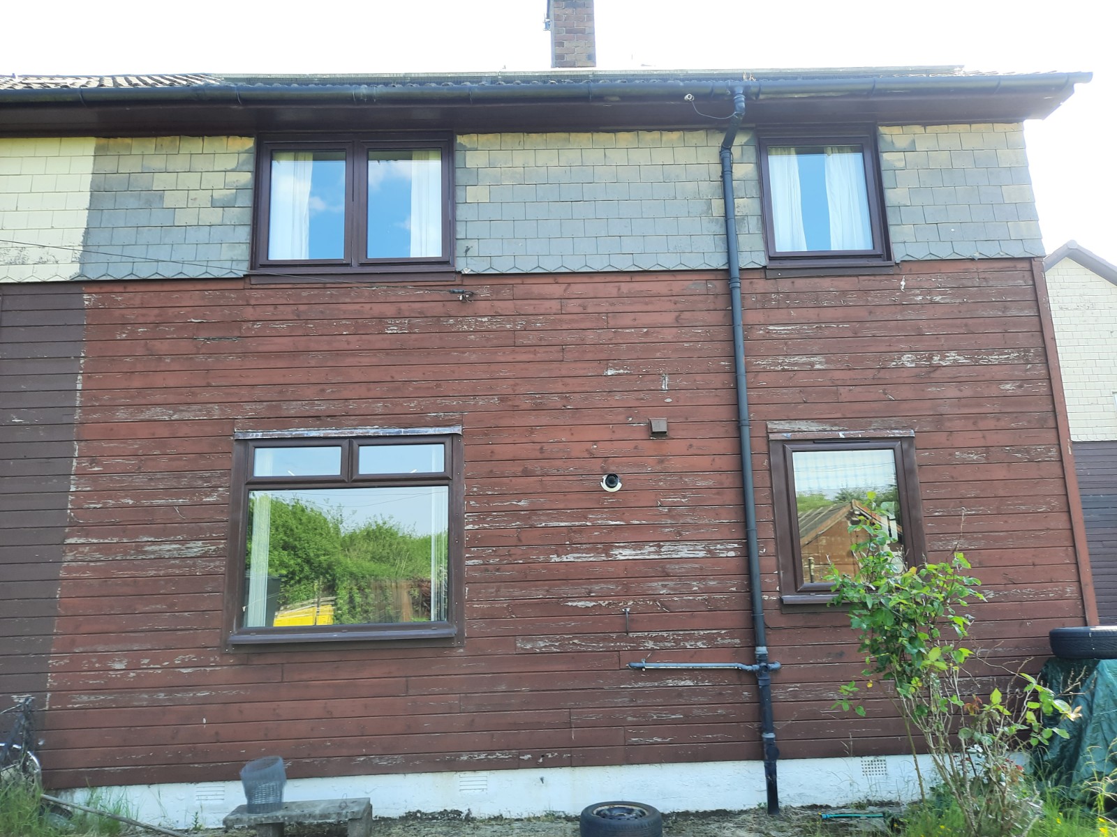 roughcast render repair on rear wall with cladding removed