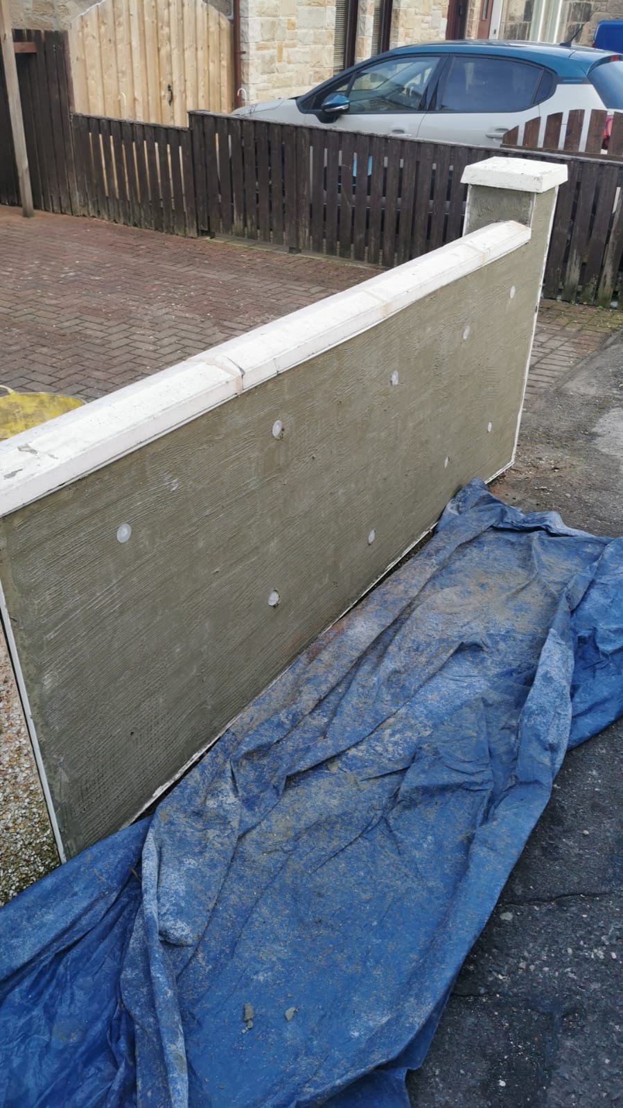 solid wall insulation Edinburgh mid-application with blue groundsheet