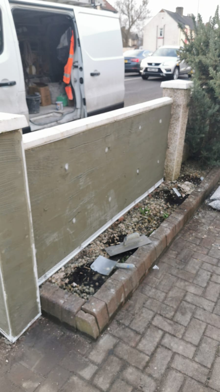 external wall insulation Edinburgh installation on garden boundary
