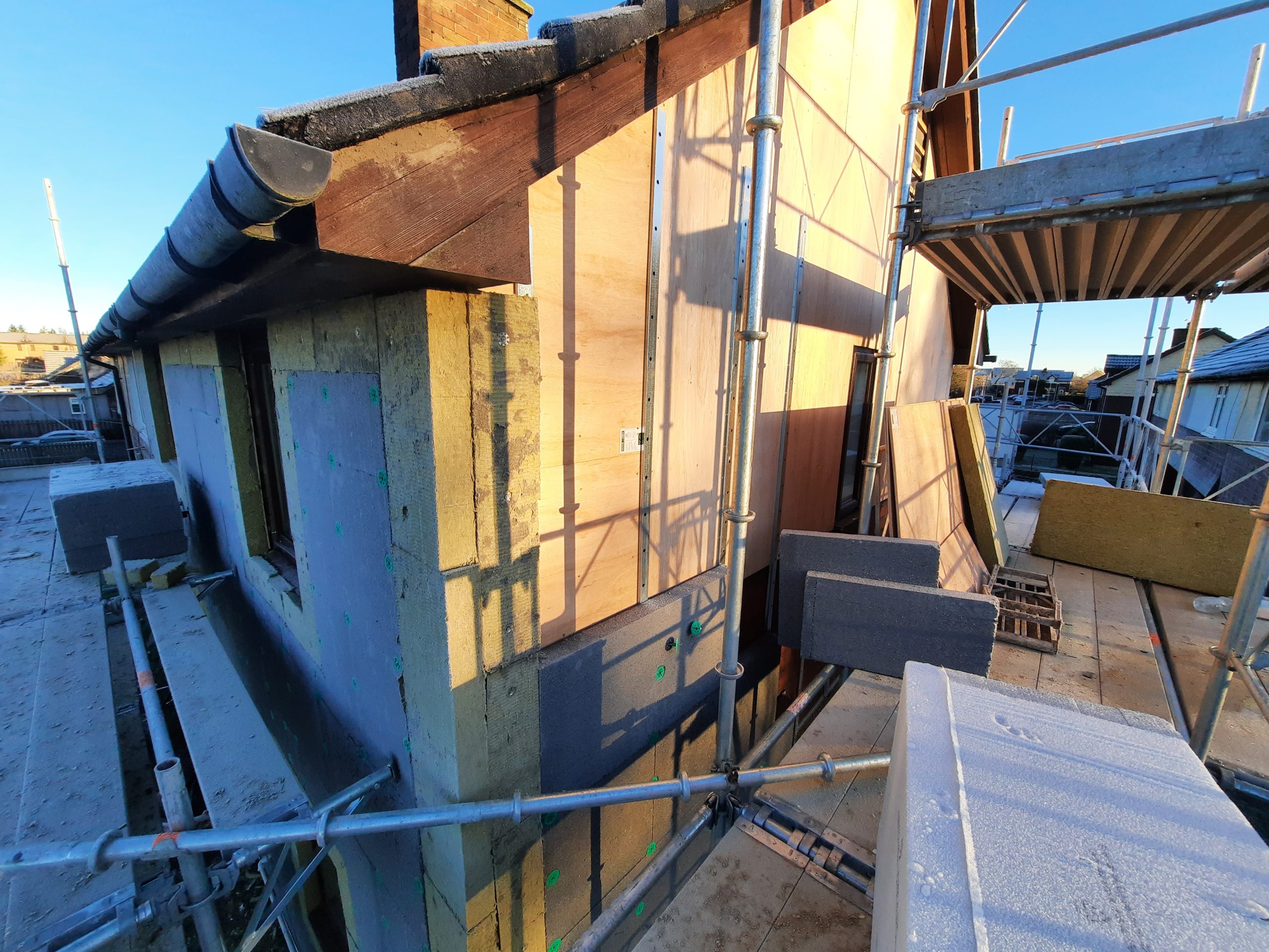 house rendering Edinburgh with yellow insulation layer exposed