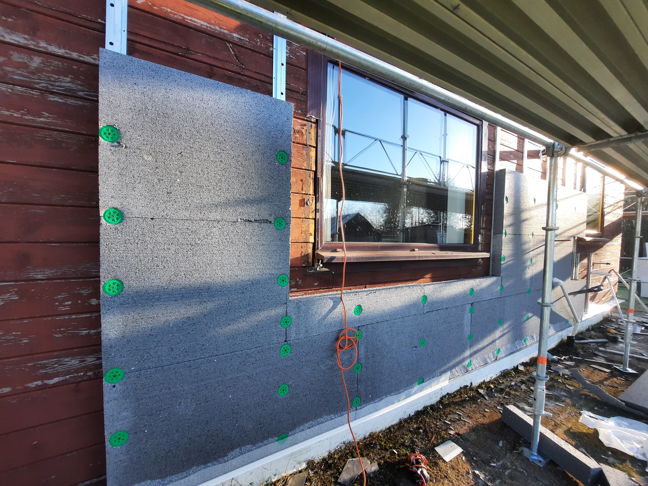 roughcast repair in progress with exterior insulation boards