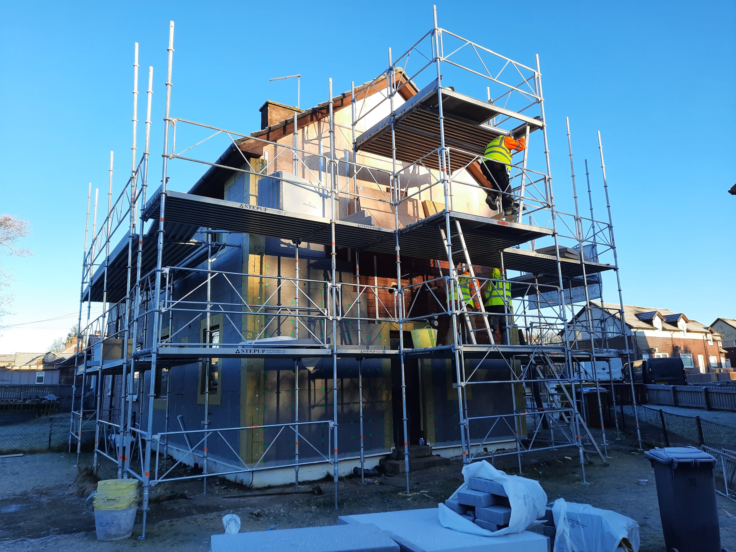 roughcasting Edinburgh on scaffolded multi-storey building under construction