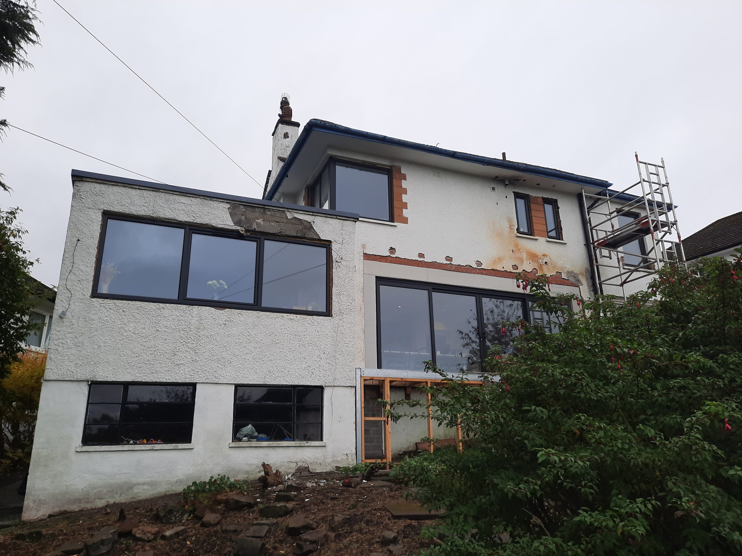 roughcast render repair on modernised rear elevation