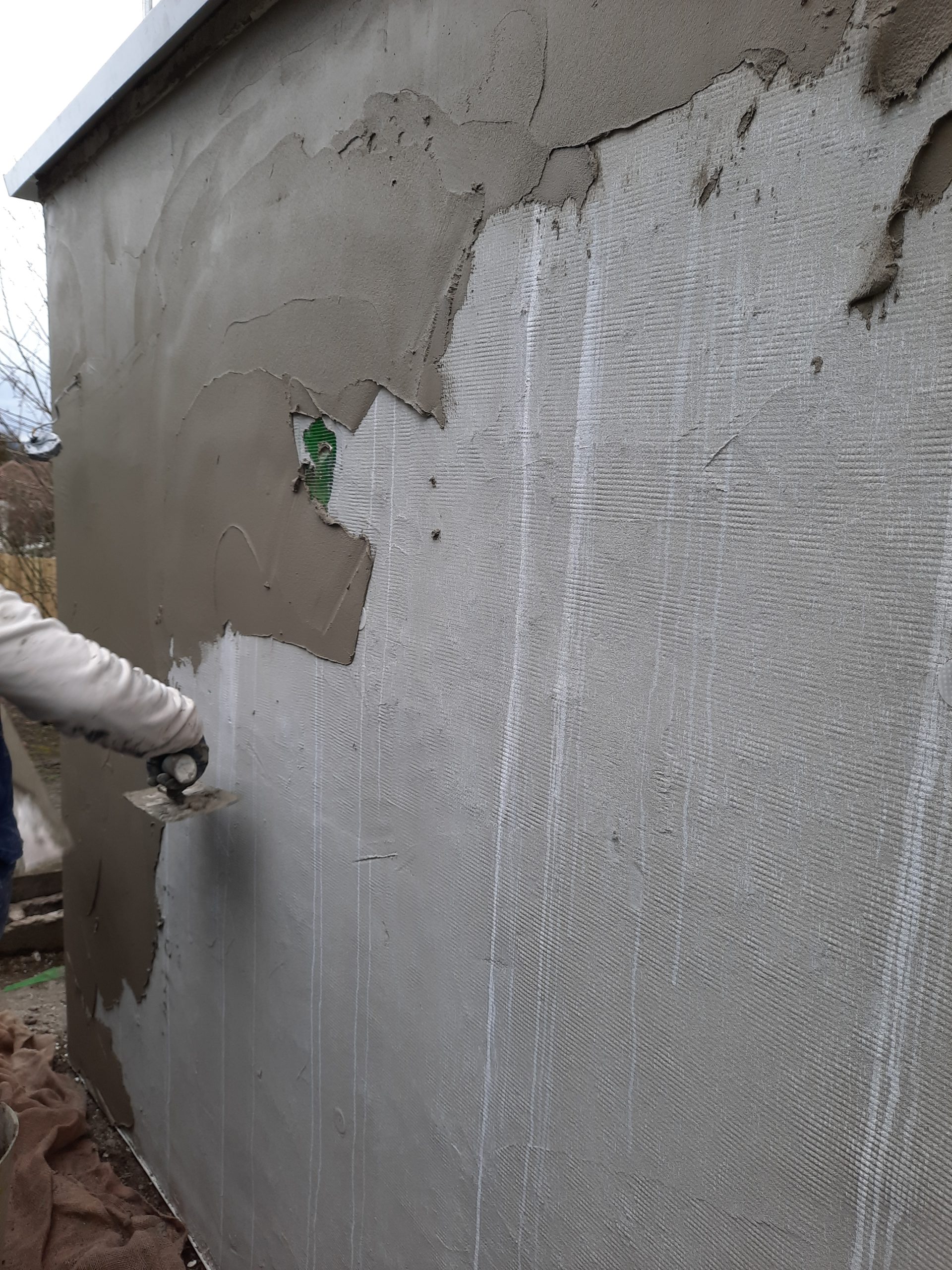 Rendering Edinburgh close-up of plaster being applied to wall