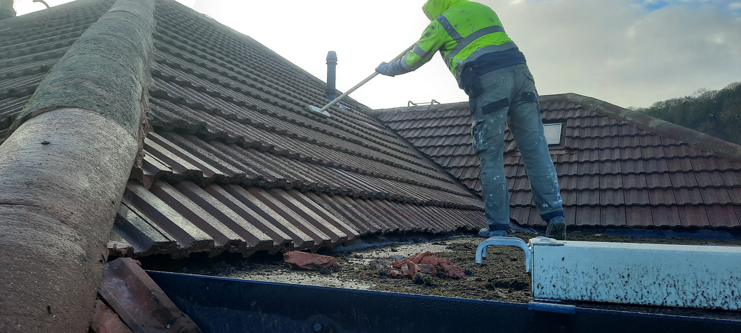 roughcast render repair during roof cleaning process
