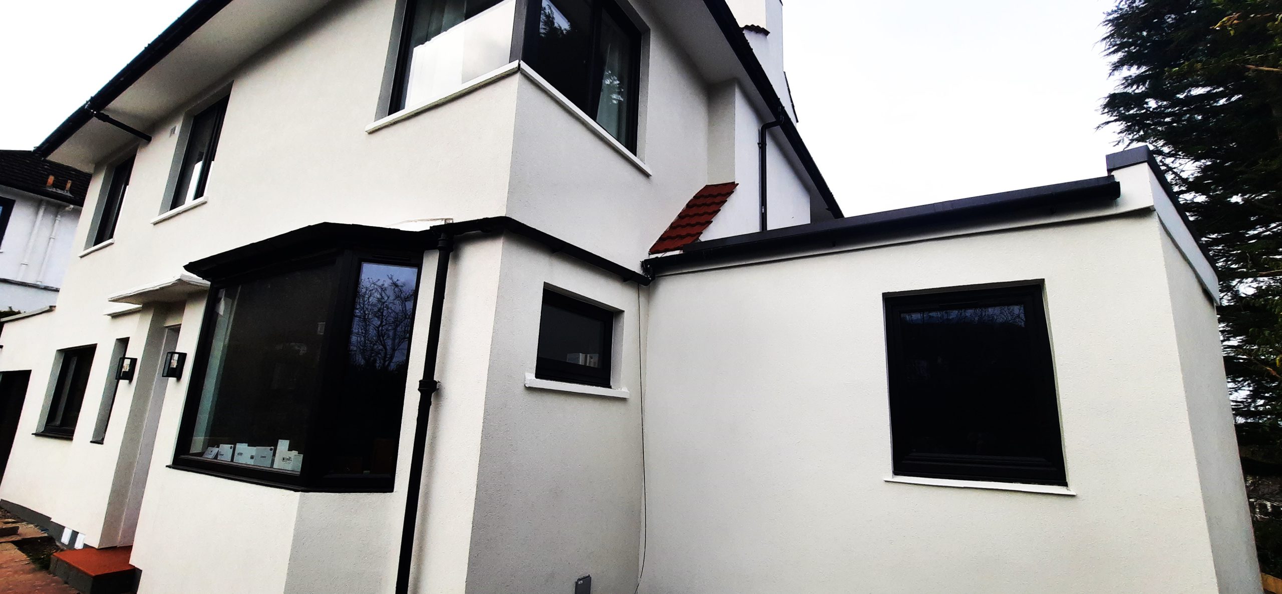 external wall insulation Edinburgh on modern black and white extension