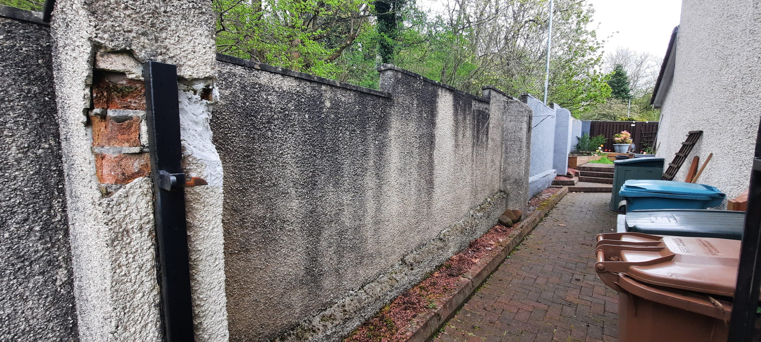 roughcasting Edinburgh on aged boundary wall