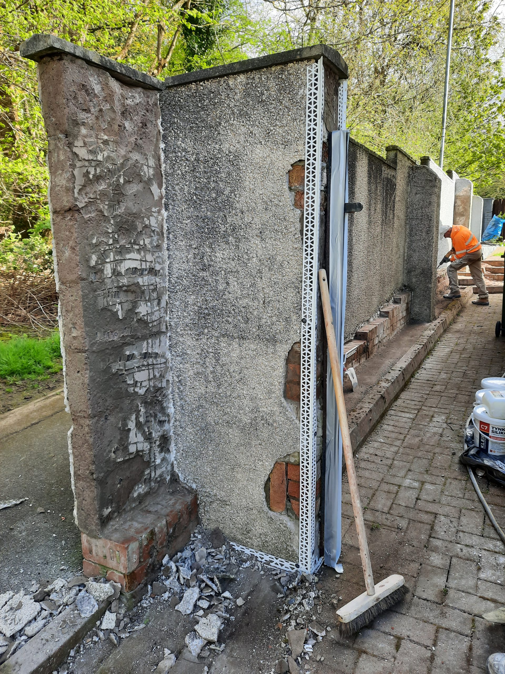 house rendering Edinburgh with wall debris at base