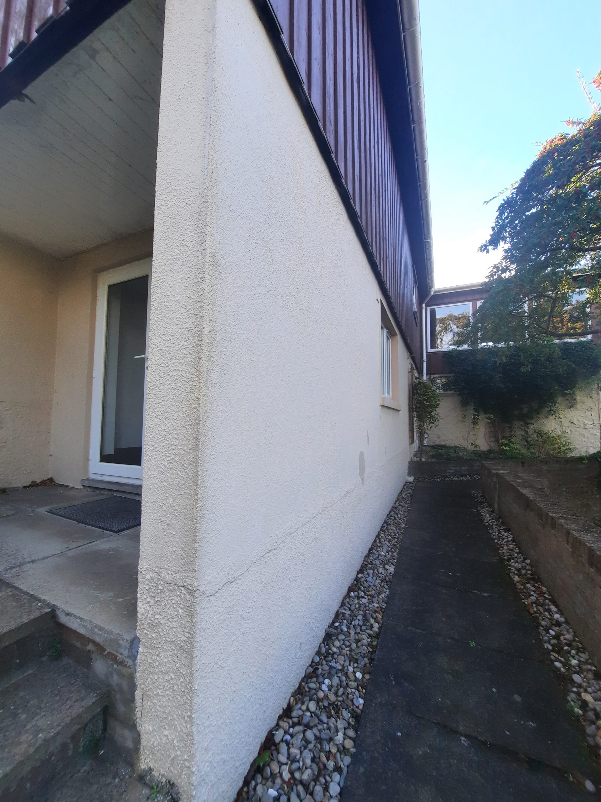roughcast render repair along long narrow side passage