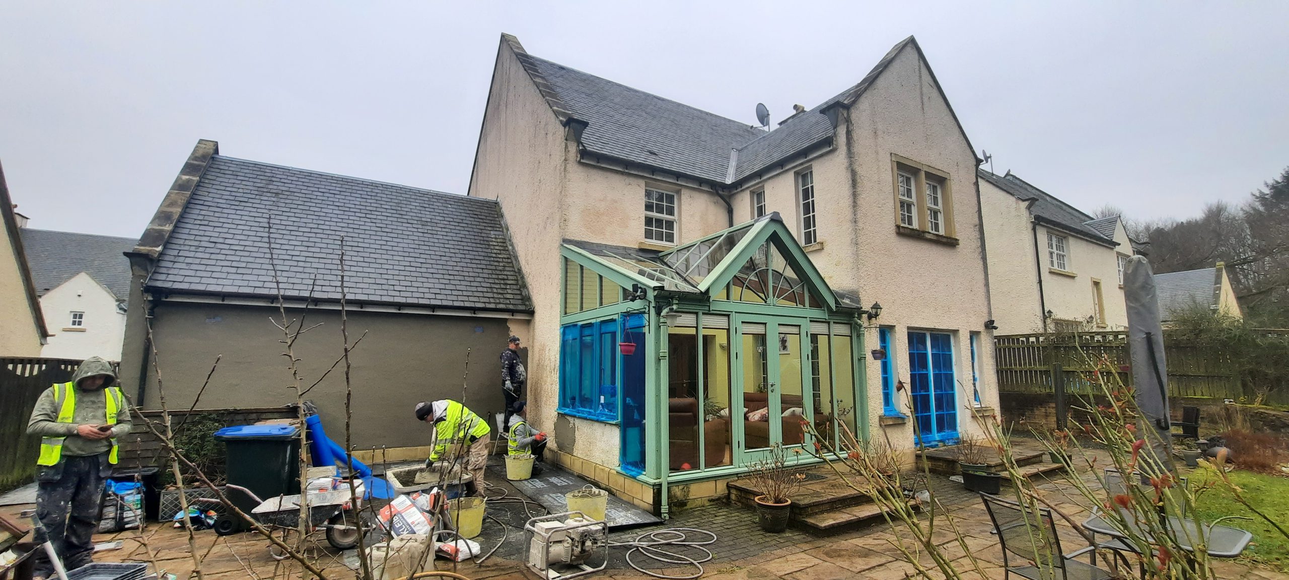 roughcast render repair on stone wall with decayed coating