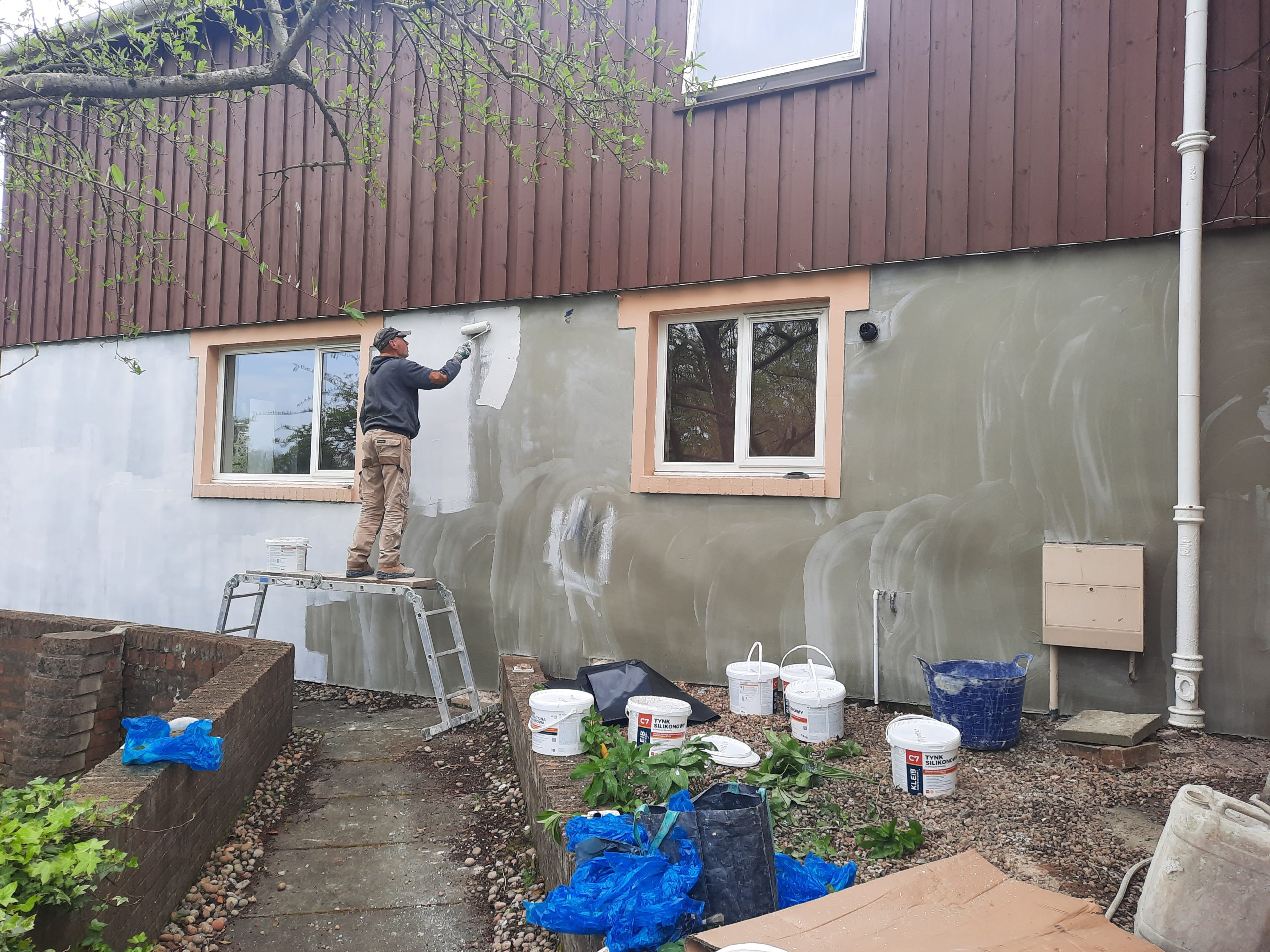 roughcast repair during renovation with tools and materials