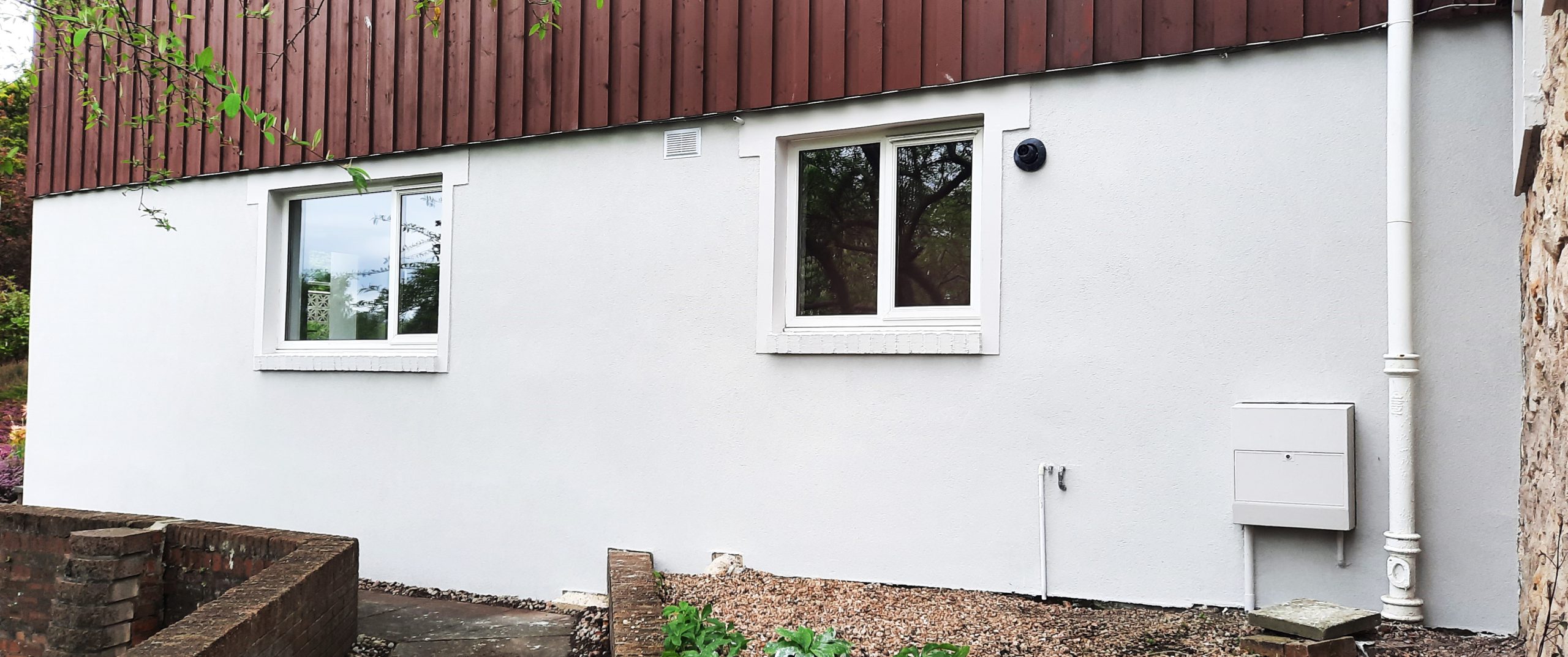 roughcasting Edinburgh on modern white ground floor wall