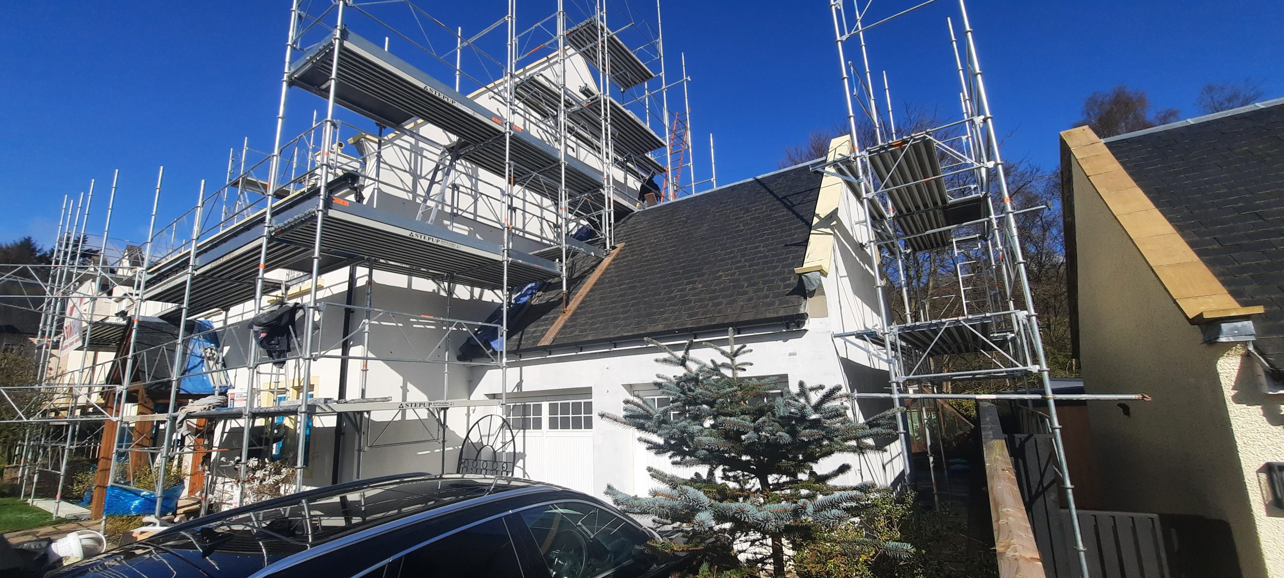 roughcast render Edinburgh on house with wooden porch