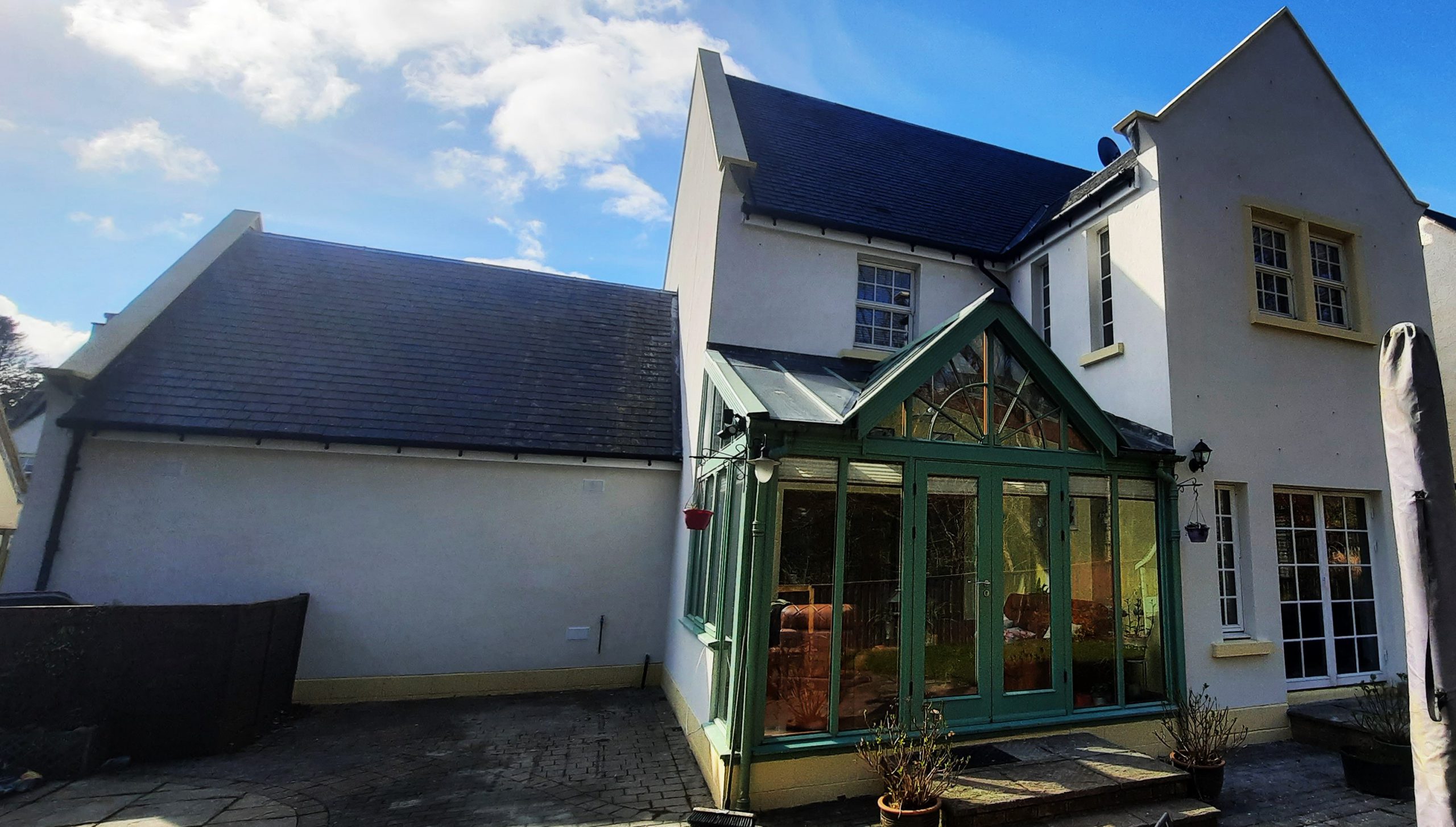 roughcast render repair around glass patio extension