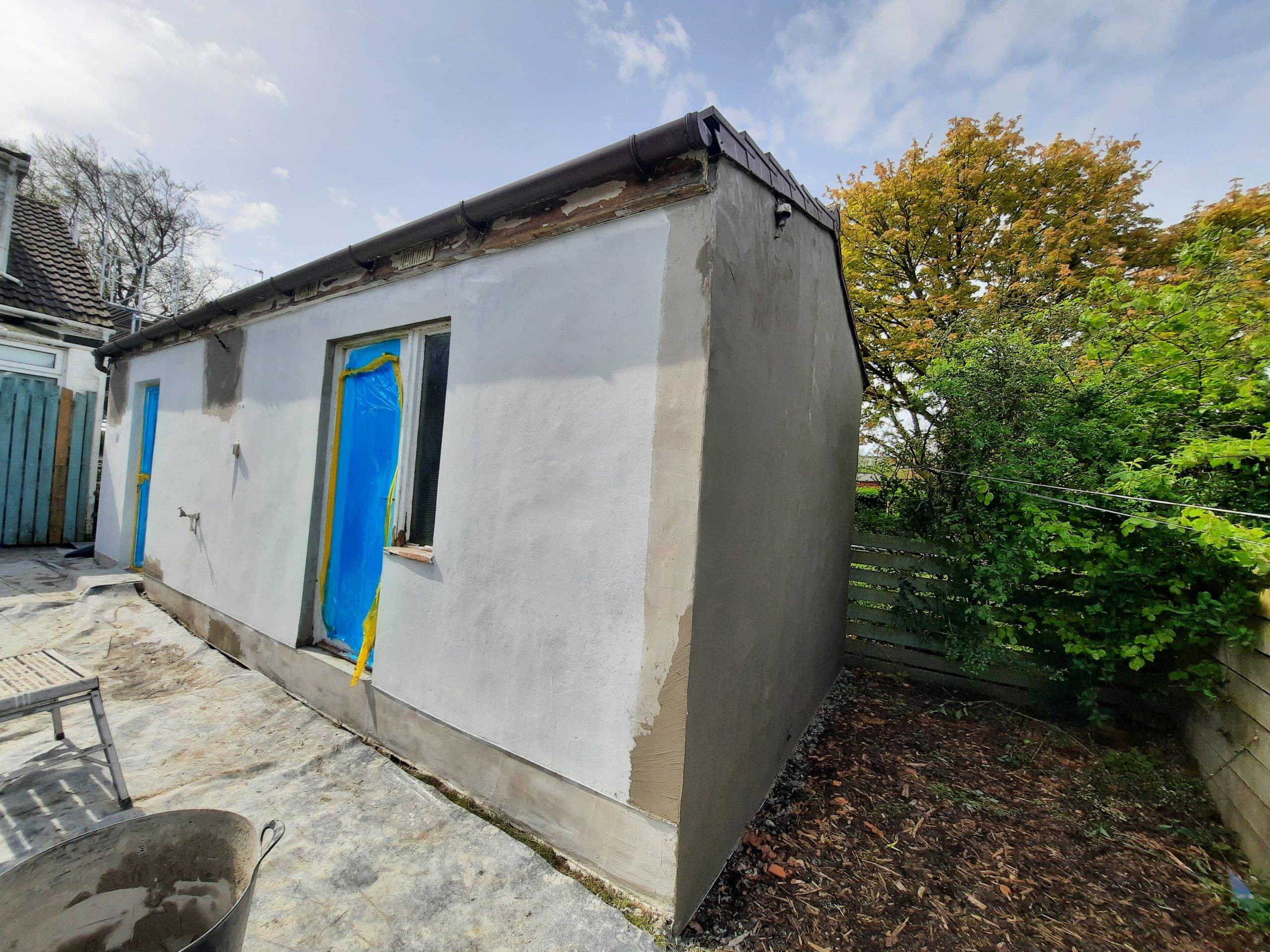 roughcaster Edinburgh renovating small outbuilding wall