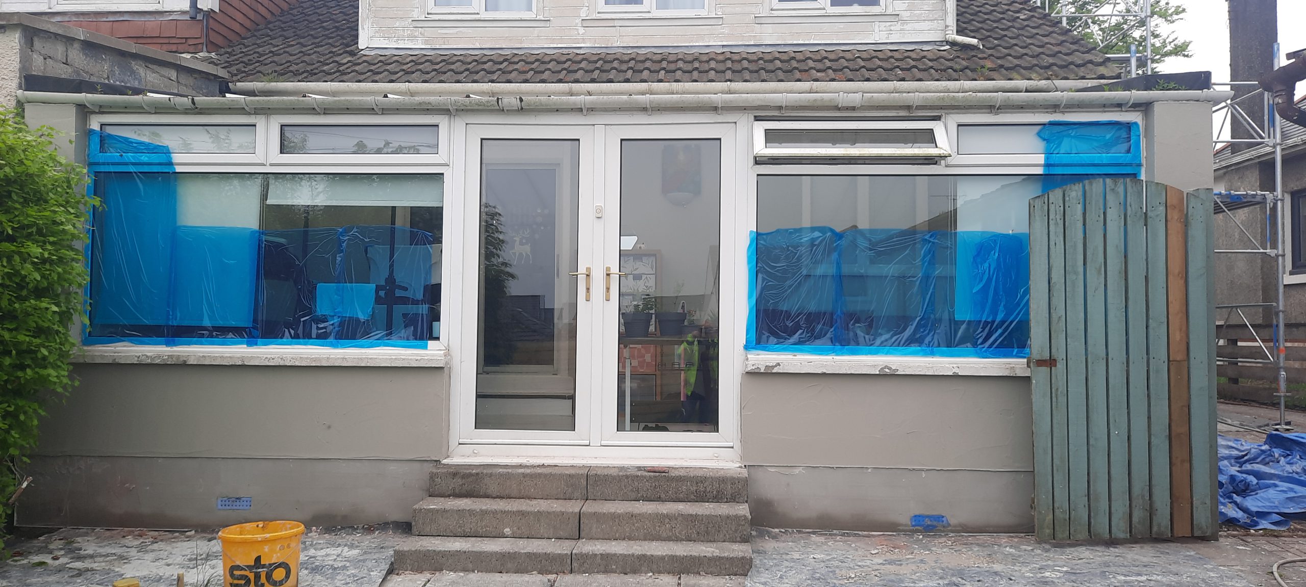 roughcast render repair around glass patio doors
